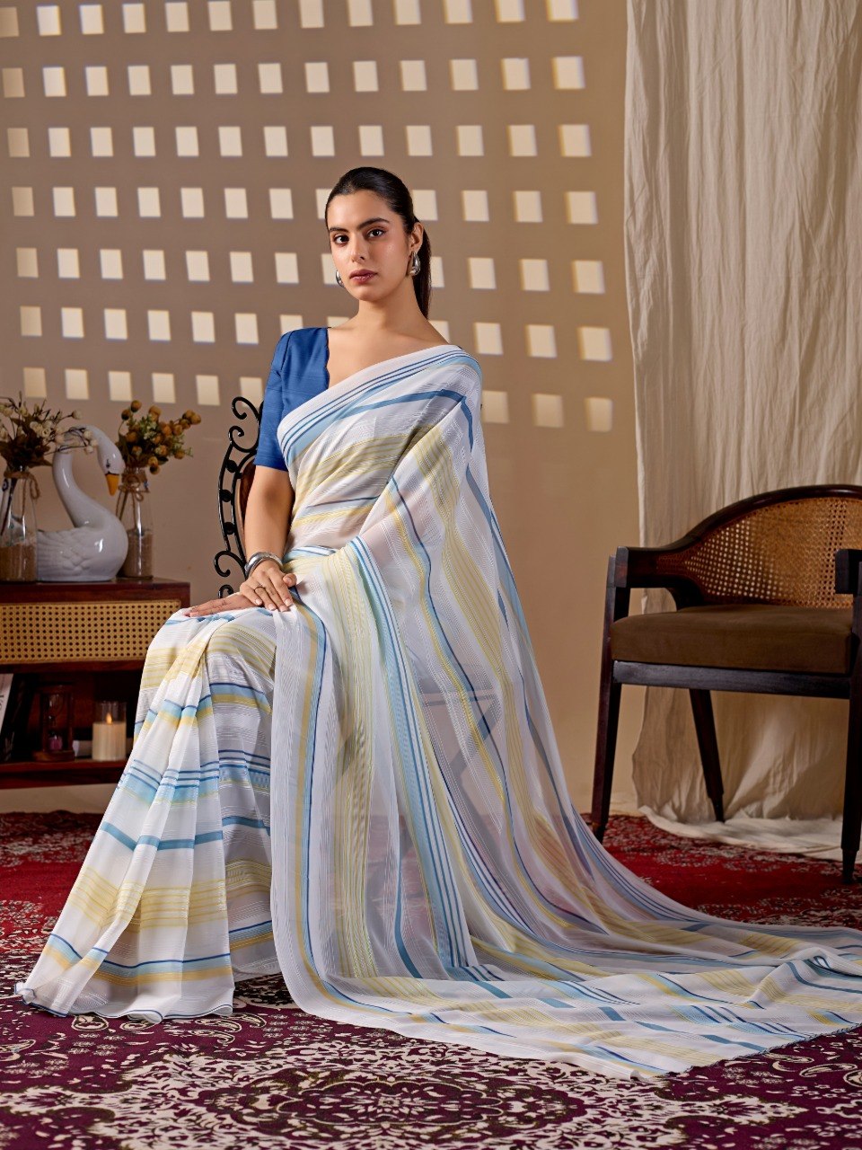 Premium Monsoon Saree featuring a soothing white base enhanced with elegant blue and yellow stripe patterns of saree