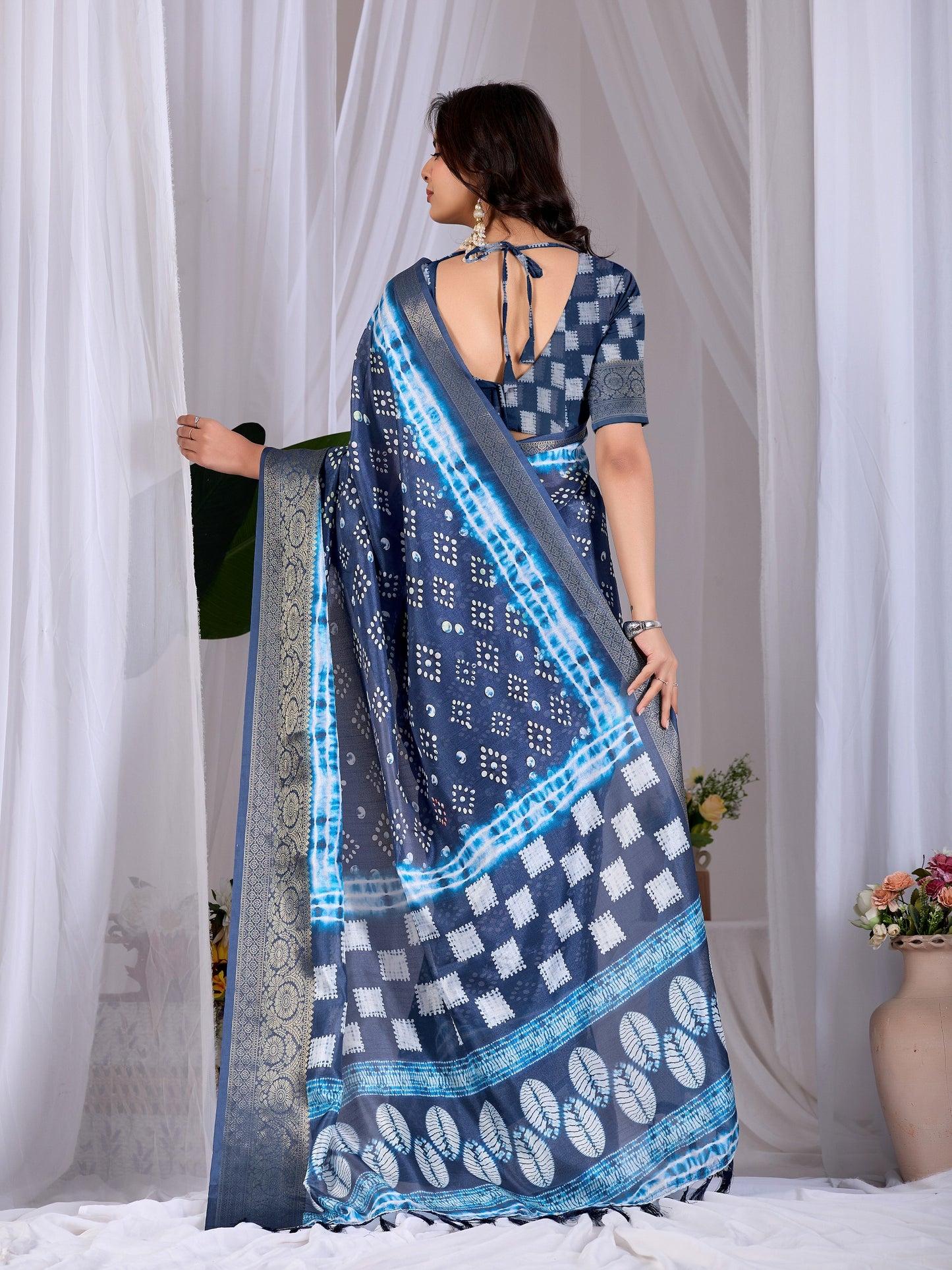 Soft Lichi Silk Saree with stylish bandhani-inspired dot patterns in rich navy blue shades and a woven border