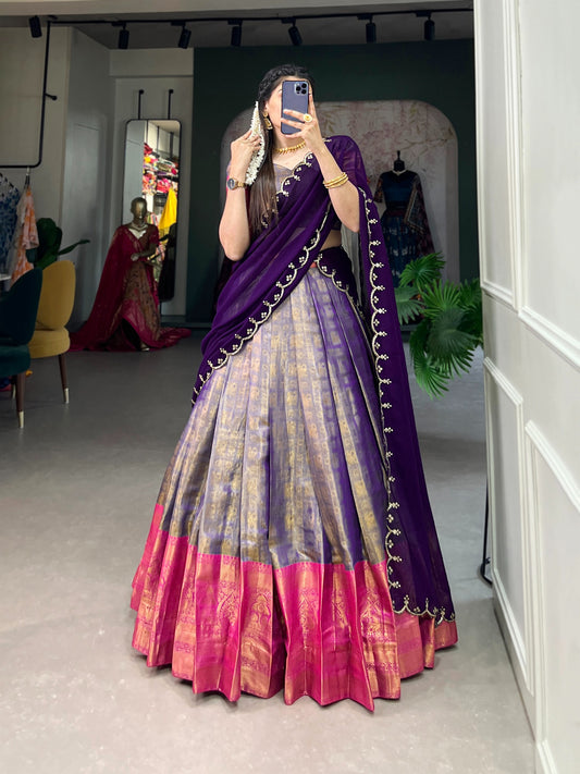 Experience the luxury of Kanjivaram silk in this regal lehenga choli ensemble, completed with a flowing embroidery dupatta.