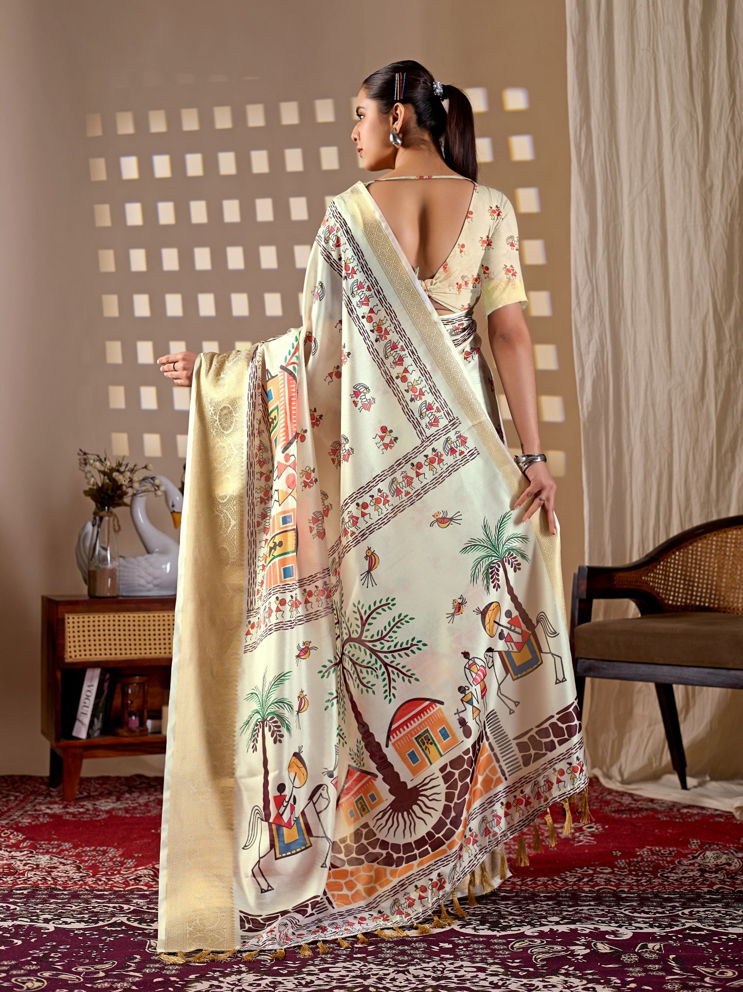 Soft Lichi Silk Saree with elegant traditional village art print in soothing cream shades and a rich woven border