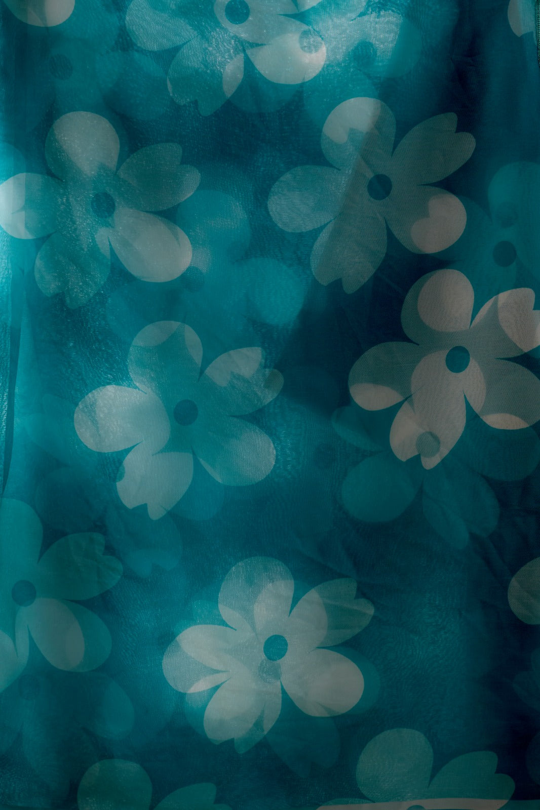 Vibrant Turquoise Blue Georgette Saree with Oversized White Floral Prints and Tassel Borders