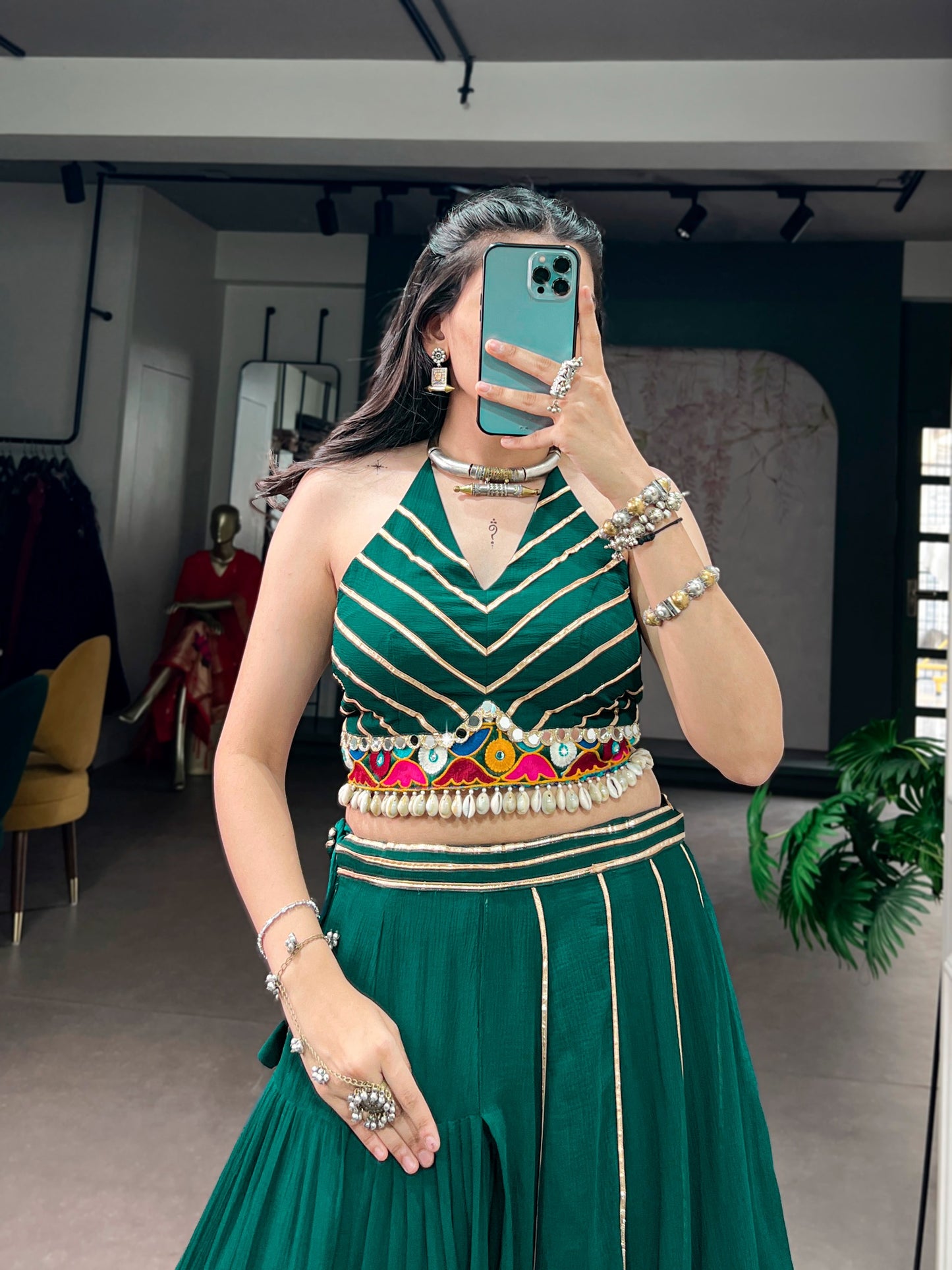 Lightweight fabric with vibrant Gamthi work, mirror detailing, Gotta Patti lace, and shell embellishments