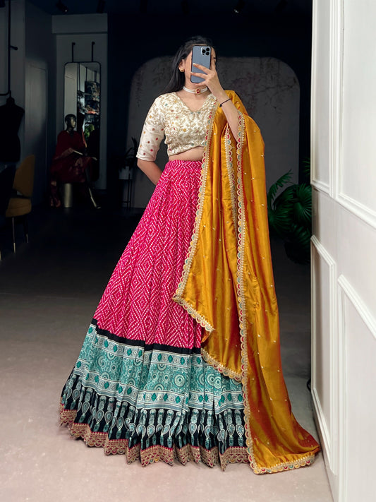 A beautiful blend of Bandhej and Ajrakh prints on soft rayon fabric, enhanced with delicate sequins, thread embroidery, and elegant lace detailing 🪞