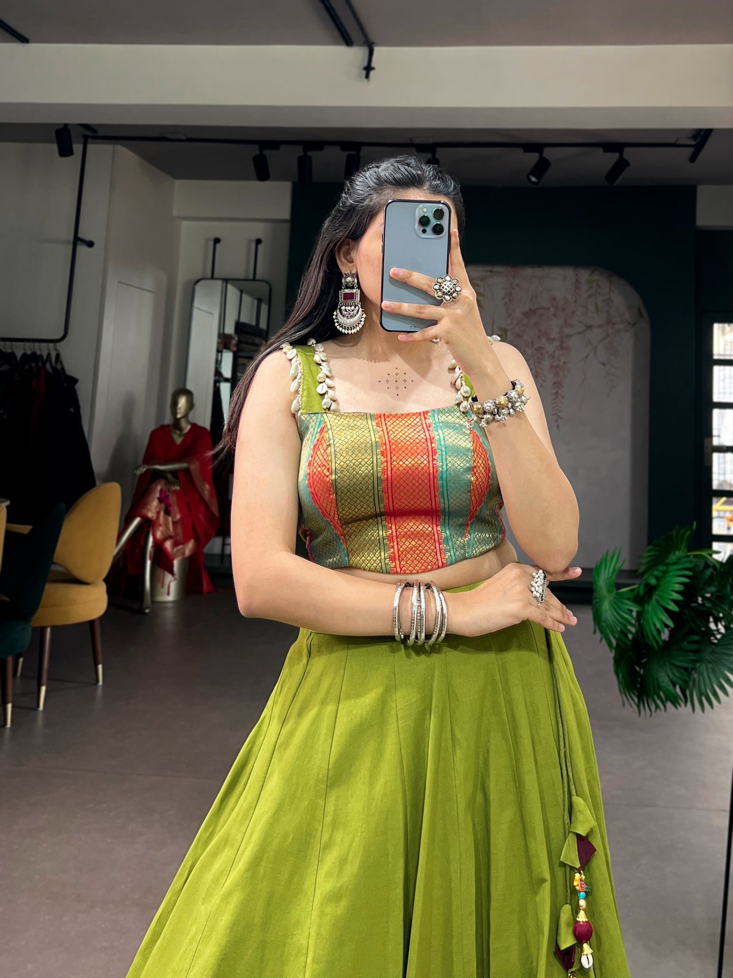 Cotton lehenga enhanced with zari weaving, embossed design work, and delicate lace touch-up.
