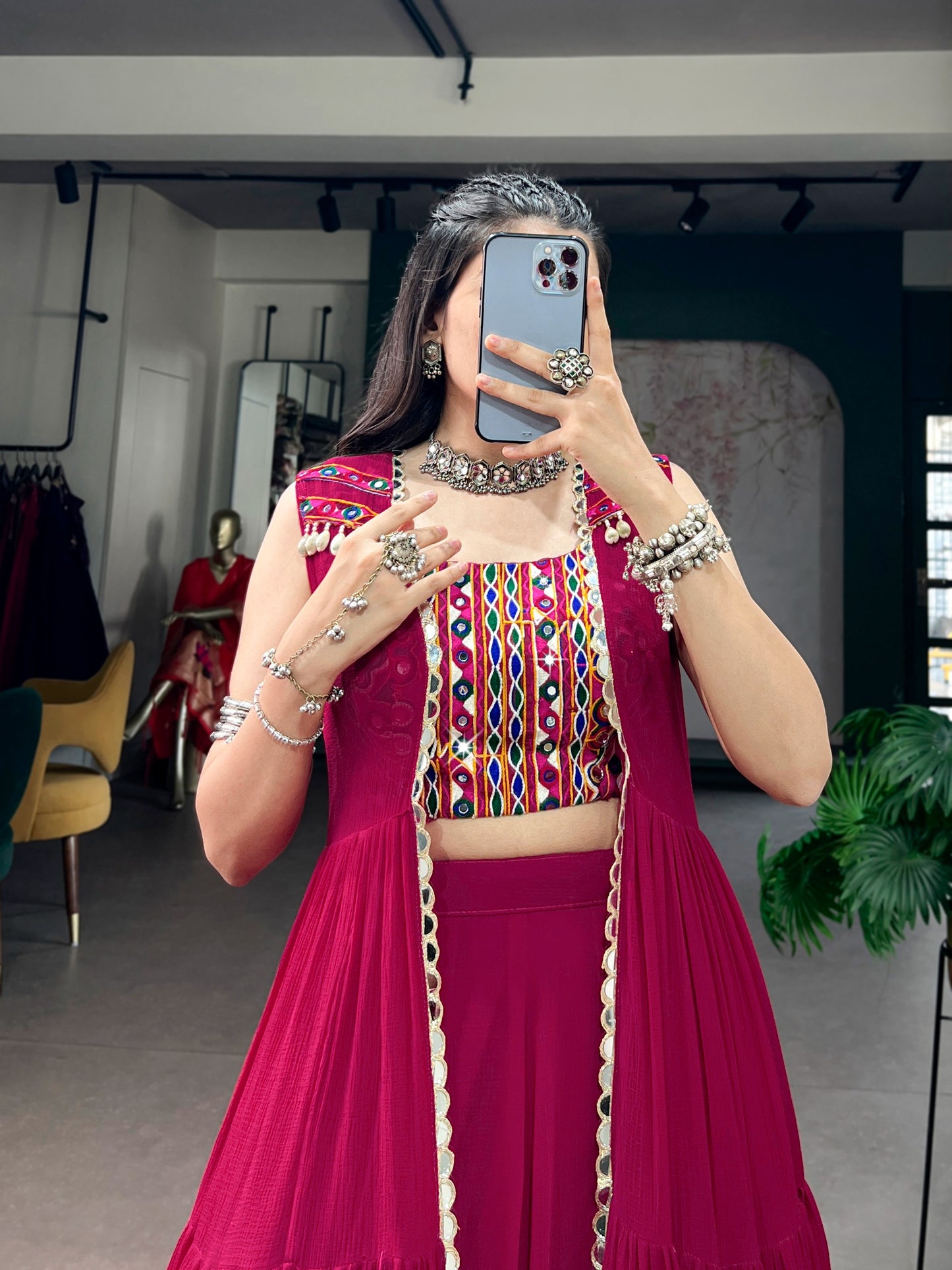 Comfort with this lightweight lehenga, highlighted by a handcrafted Gamthi blouse, Gotta Patti lace detailing, and a mirror-adorned long koti.