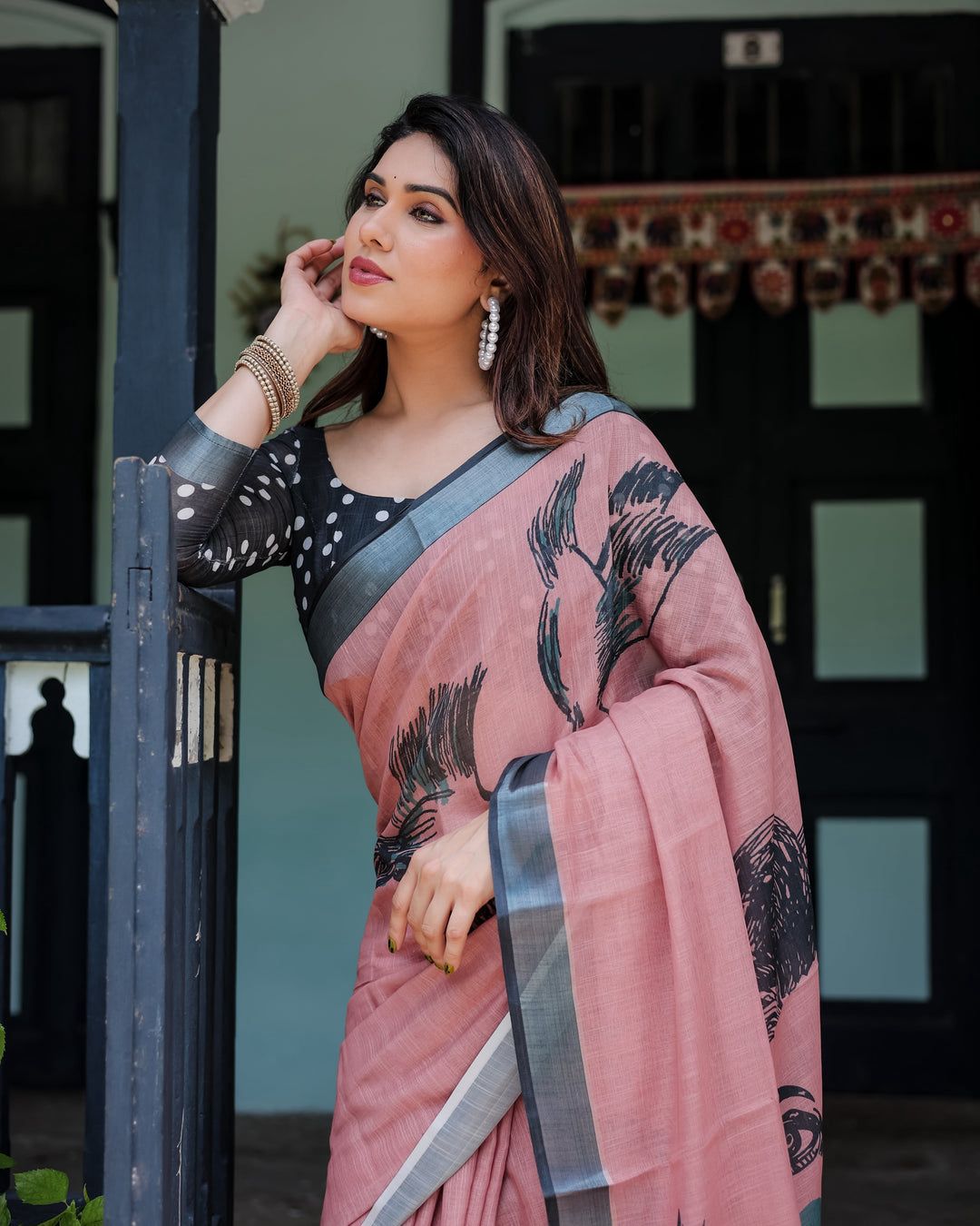 Artistic Salmon Pink Cotton Linen Saree featuring Charcoal Black Bird Sketch Illustrations, a Solid Slate Gray Border, and a Matching Polka-Dotted Blouse