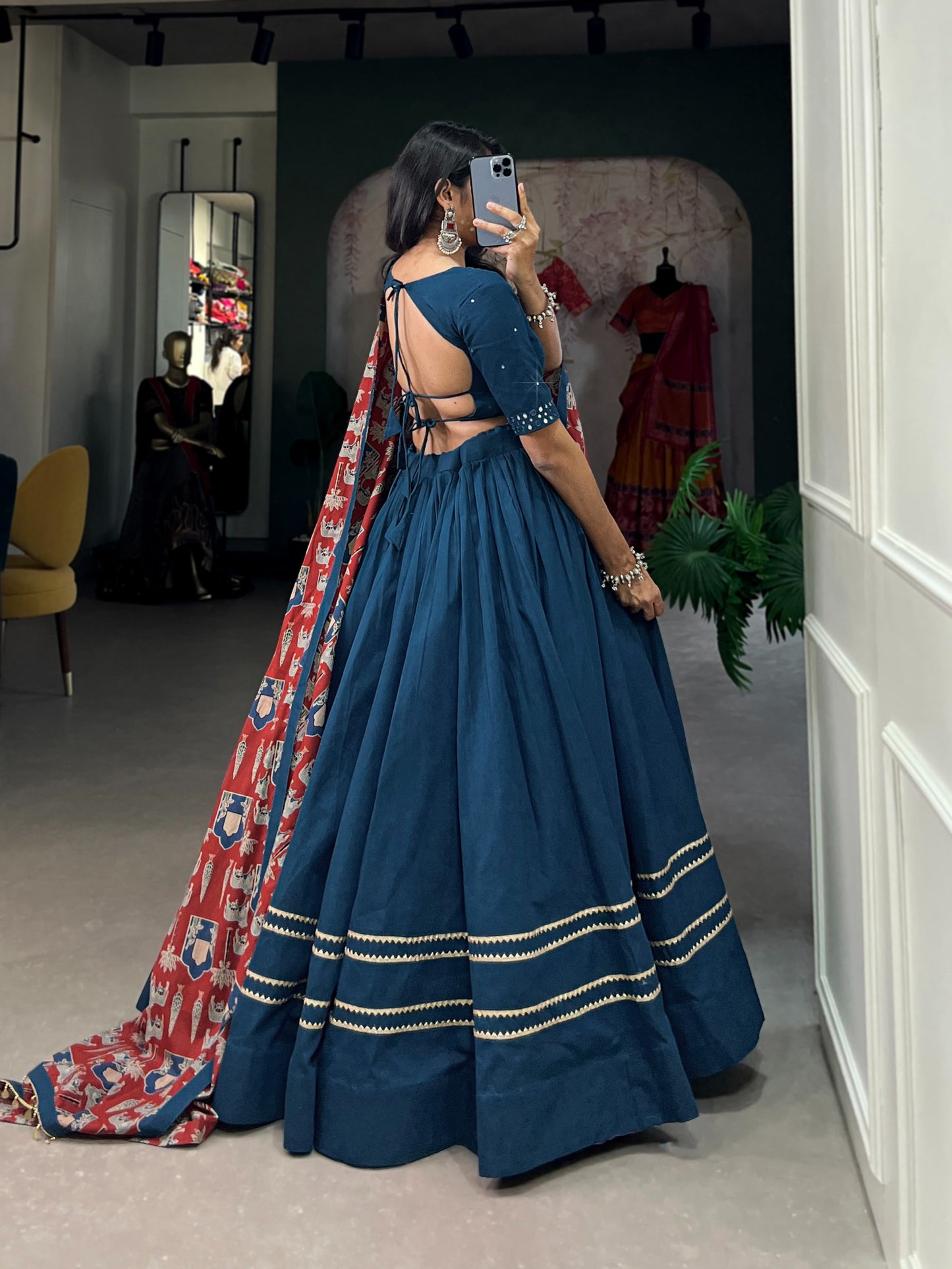 Dance through Navratri nights in this beautifully printed pure cotton lehenga choli. Complete with a matching purse and intricate coin lace detailing, it's perfect for the celebrations! 🥰