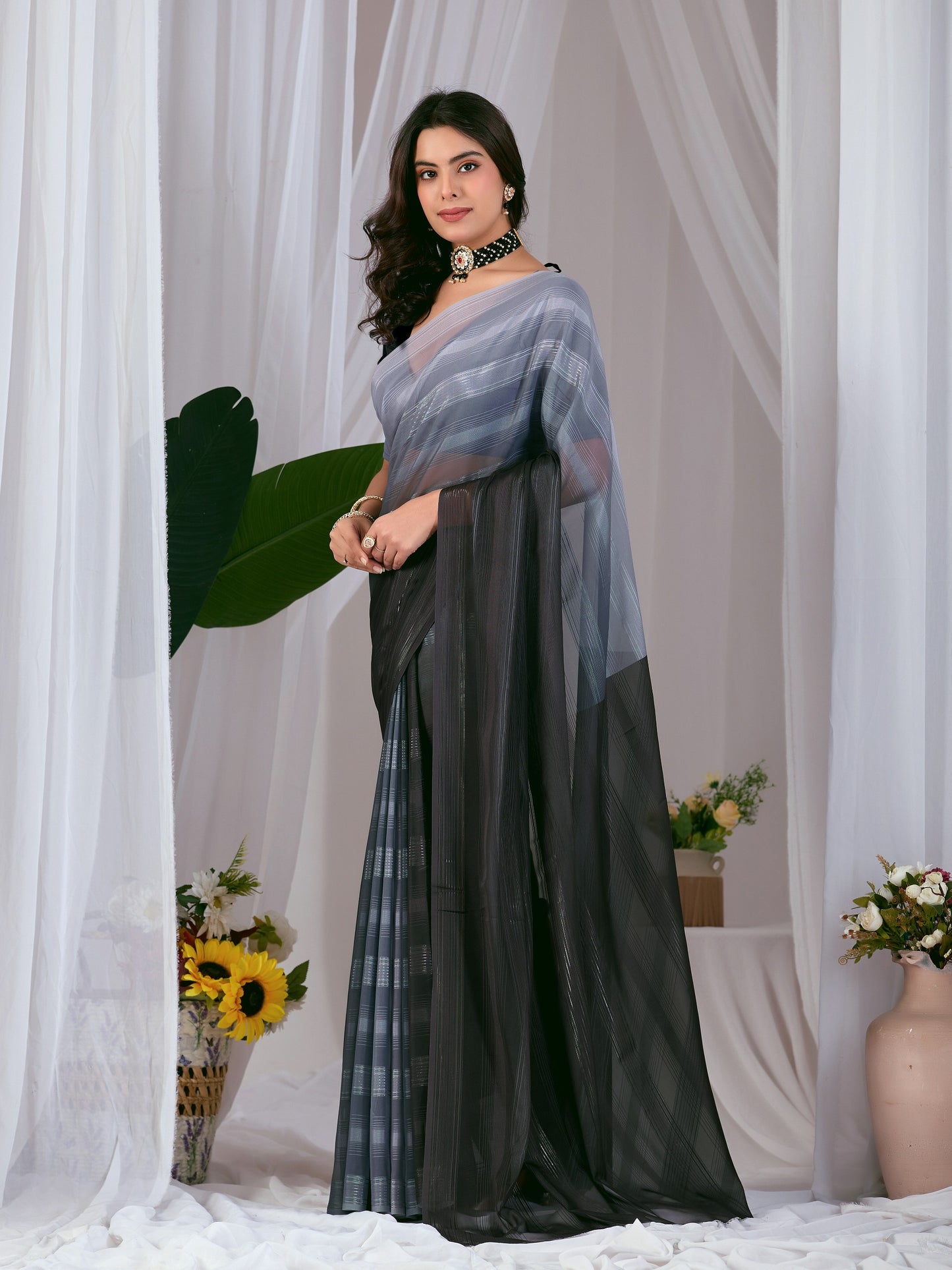 Premium Monsoon Saree featuring a classy ombré blend of deep black and smoky grey tones with a silky smooth flow of saree