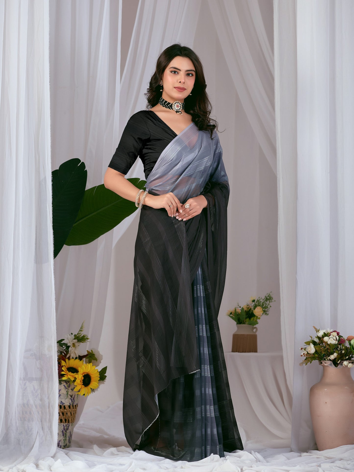 Premium Monsoon Saree featuring a classy ombré blend of deep black and smoky grey tones with a silky smooth flow of saree
