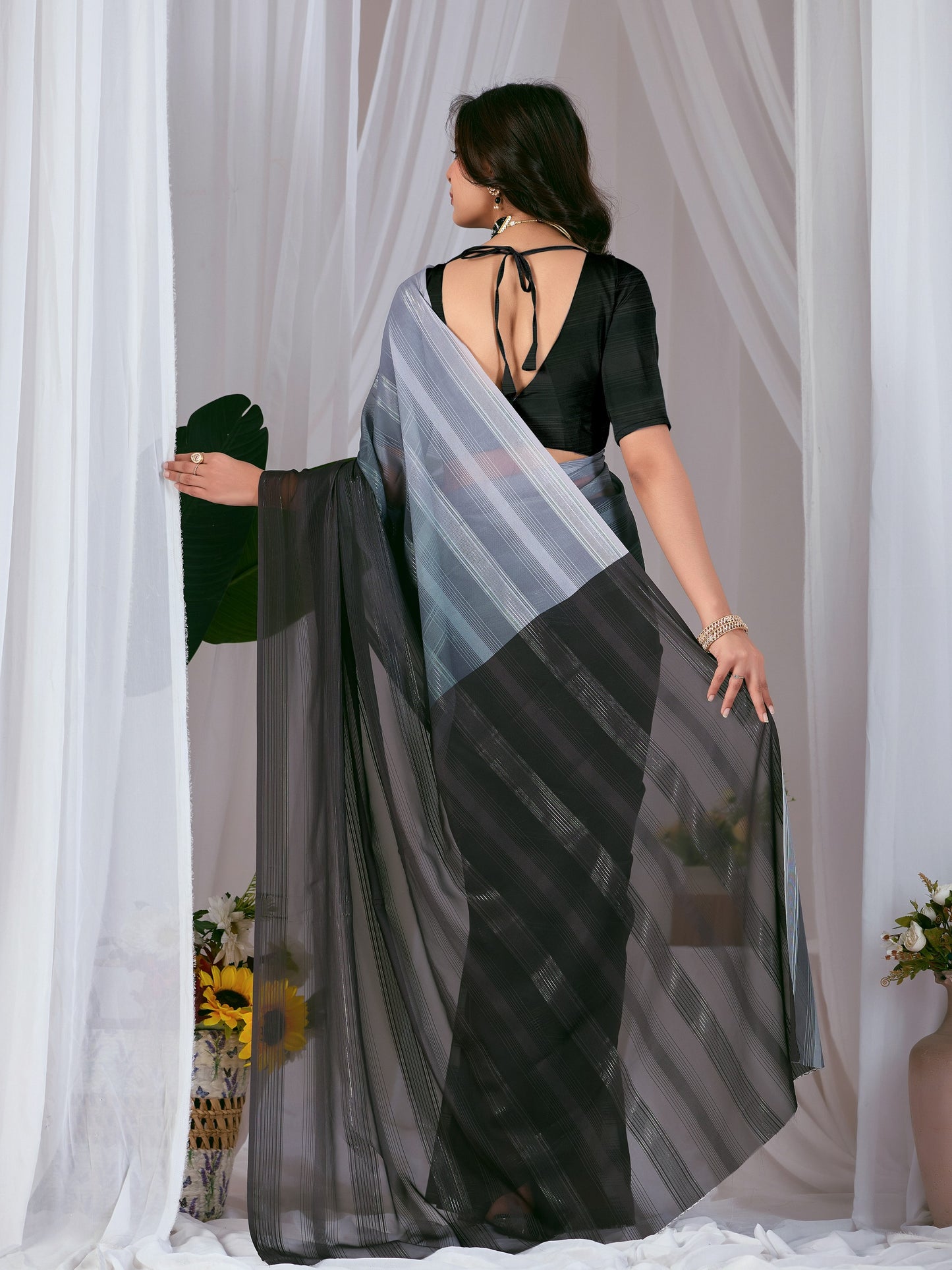 Premium Monsoon Saree featuring a classy ombré blend of deep black and smoky grey tones with a silky smooth flow of saree