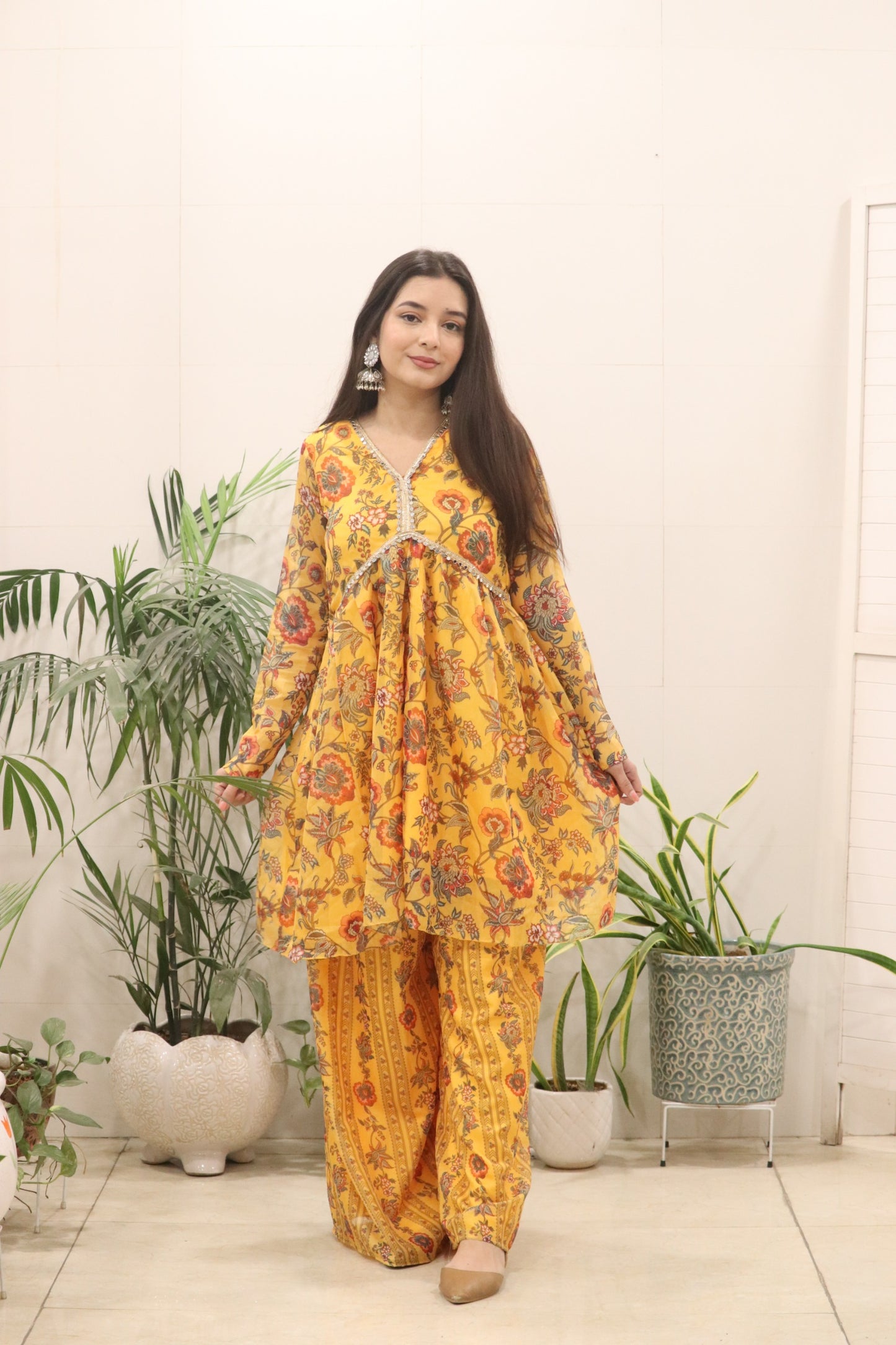 A beautiful Digital printed pure Organza silk flared kurti in a rich mustard yellow tone, adorned with all-over traditional floral prints.
