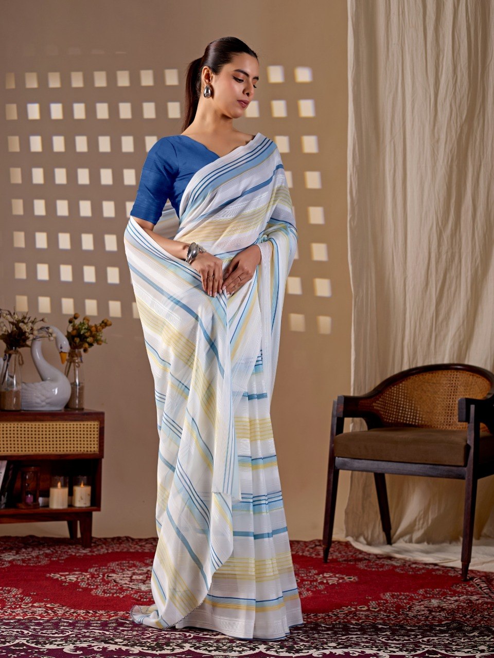 Premium Monsoon Saree featuring a soothing white base enhanced with elegant blue and yellow stripe patterns of saree