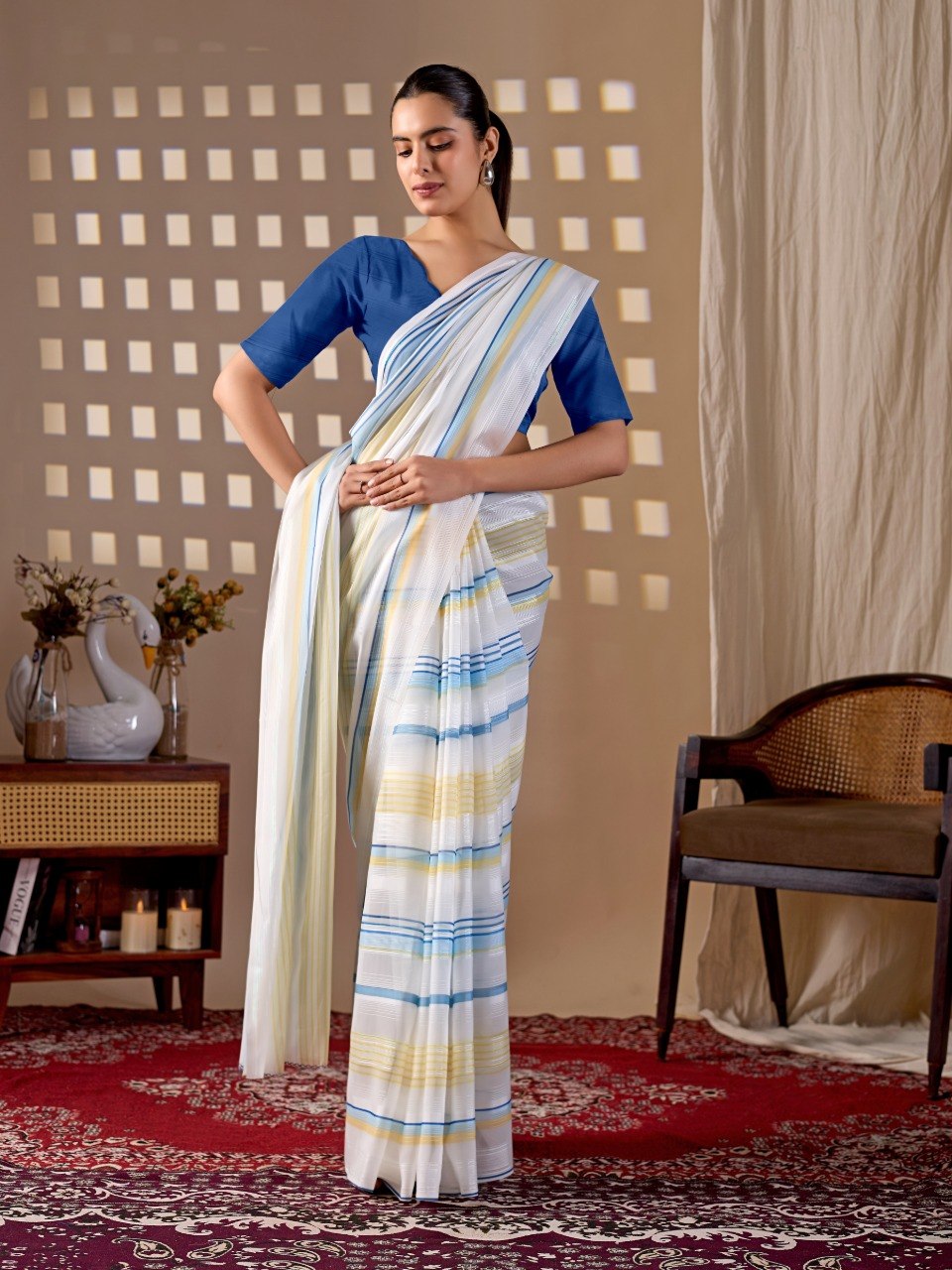 Premium Monsoon Saree featuring a soothing white base enhanced with elegant blue and yellow stripe patterns of saree
