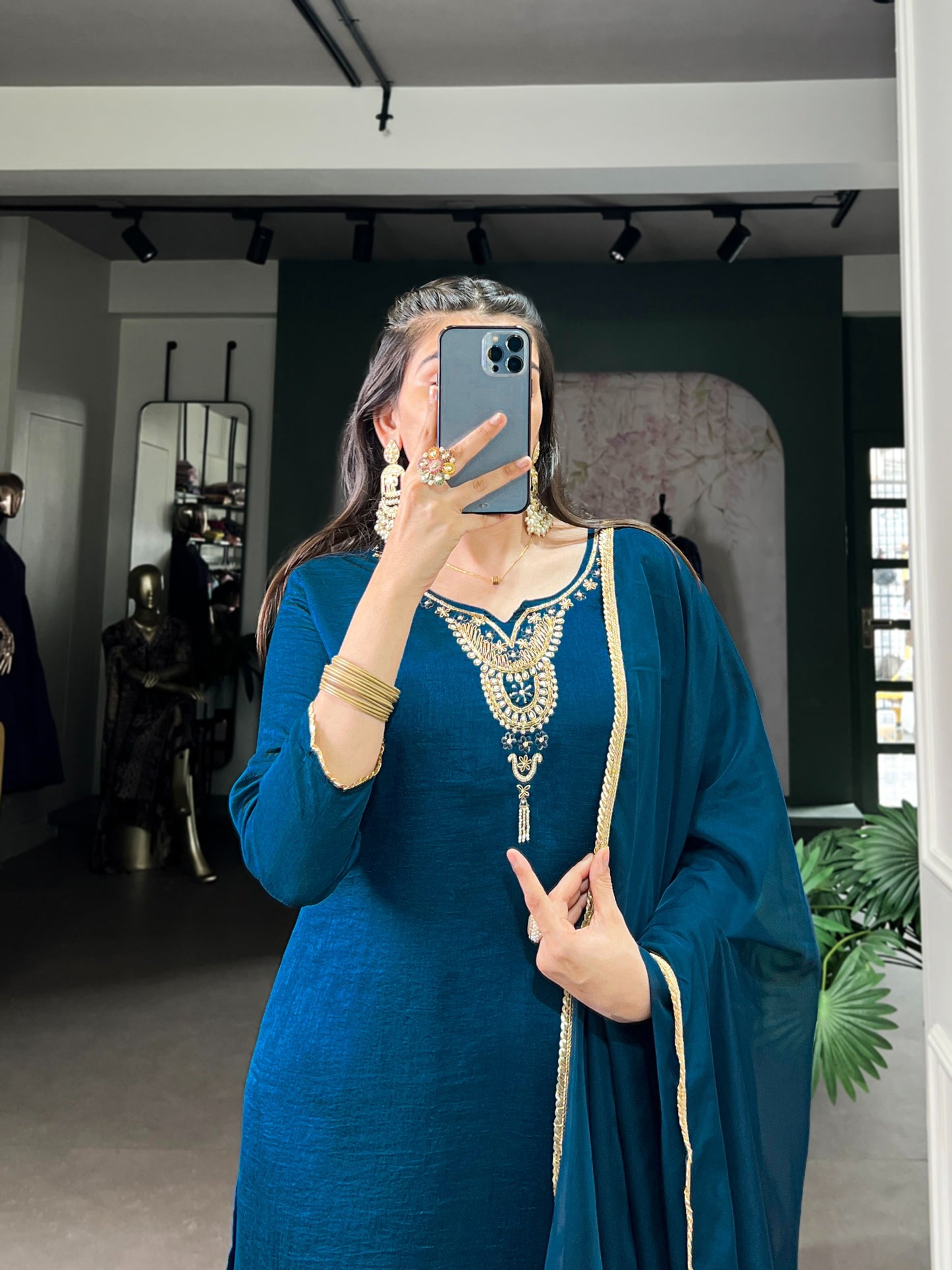 Draped in teal, dipped in grace and tradition