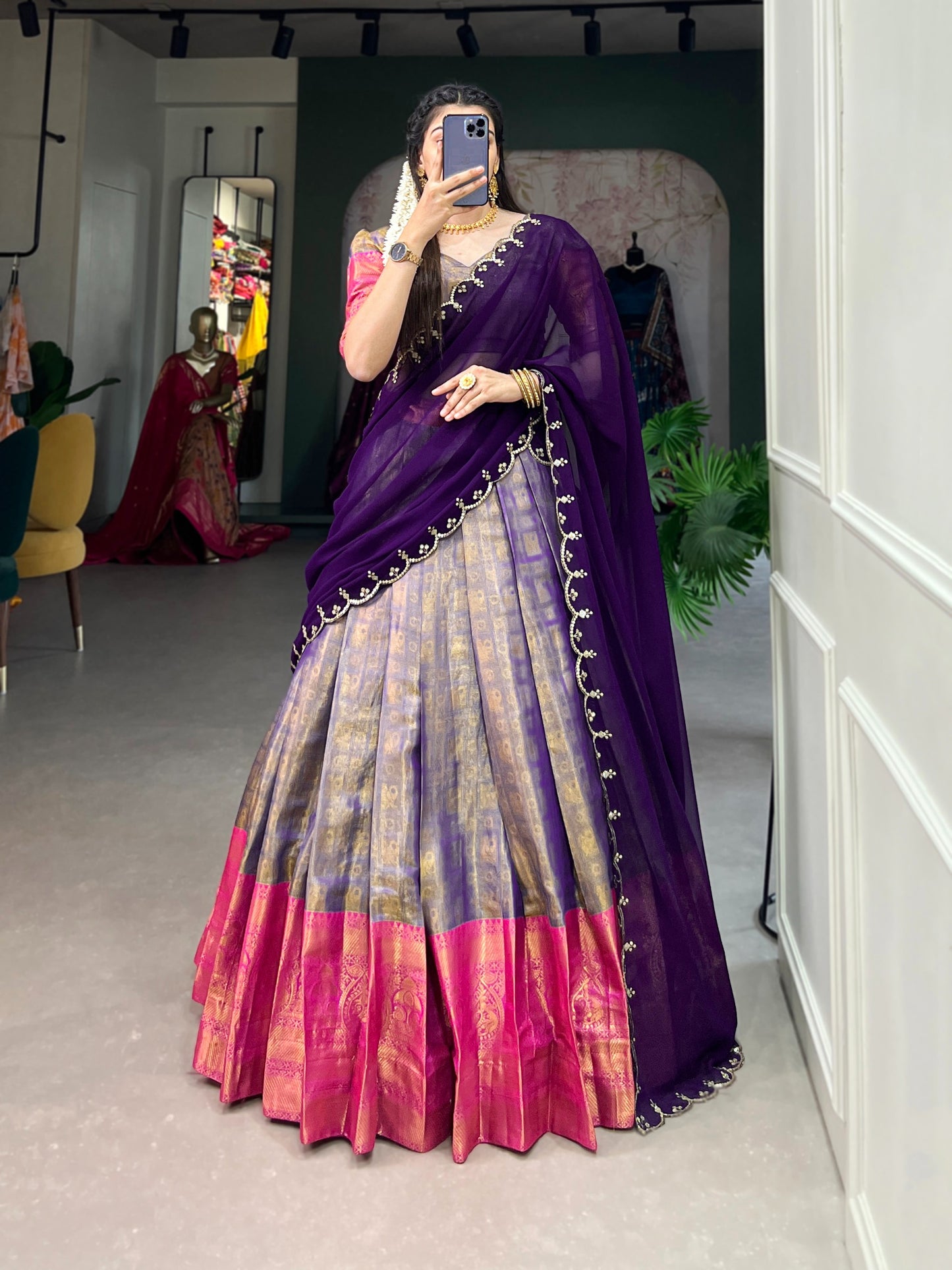 Experience the luxury of Kanjivaram silk in this regal lehenga choli ensemble, completed with a flowing embroidery dupatta.