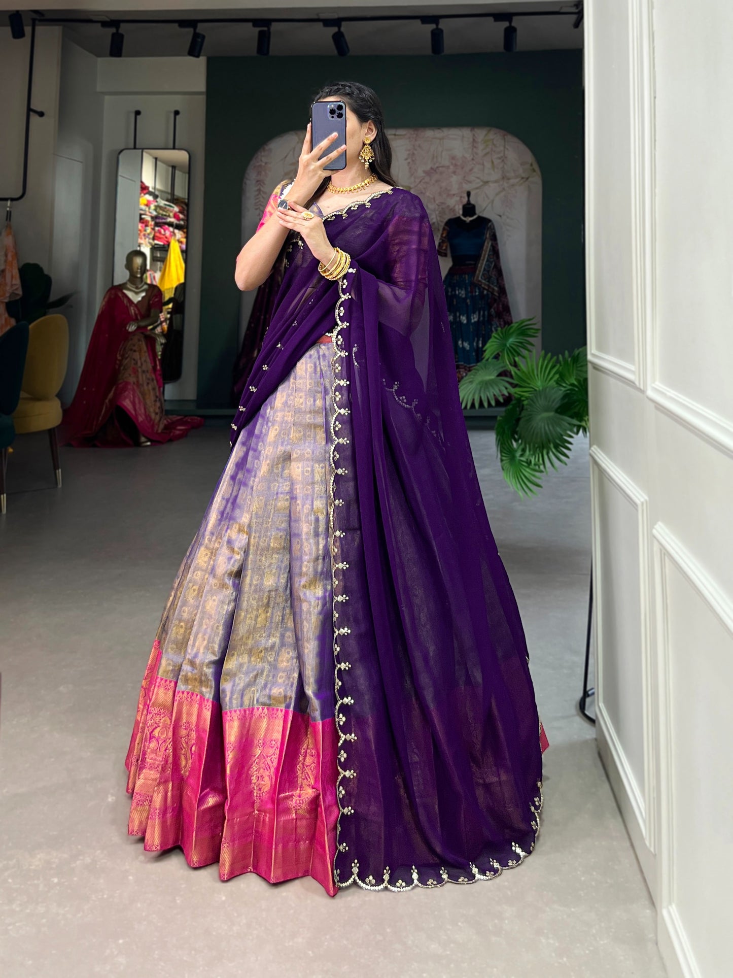 Experience the luxury of Kanjivaram silk in this regal lehenga choli ensemble, completed with a flowing embroidery dupatta.