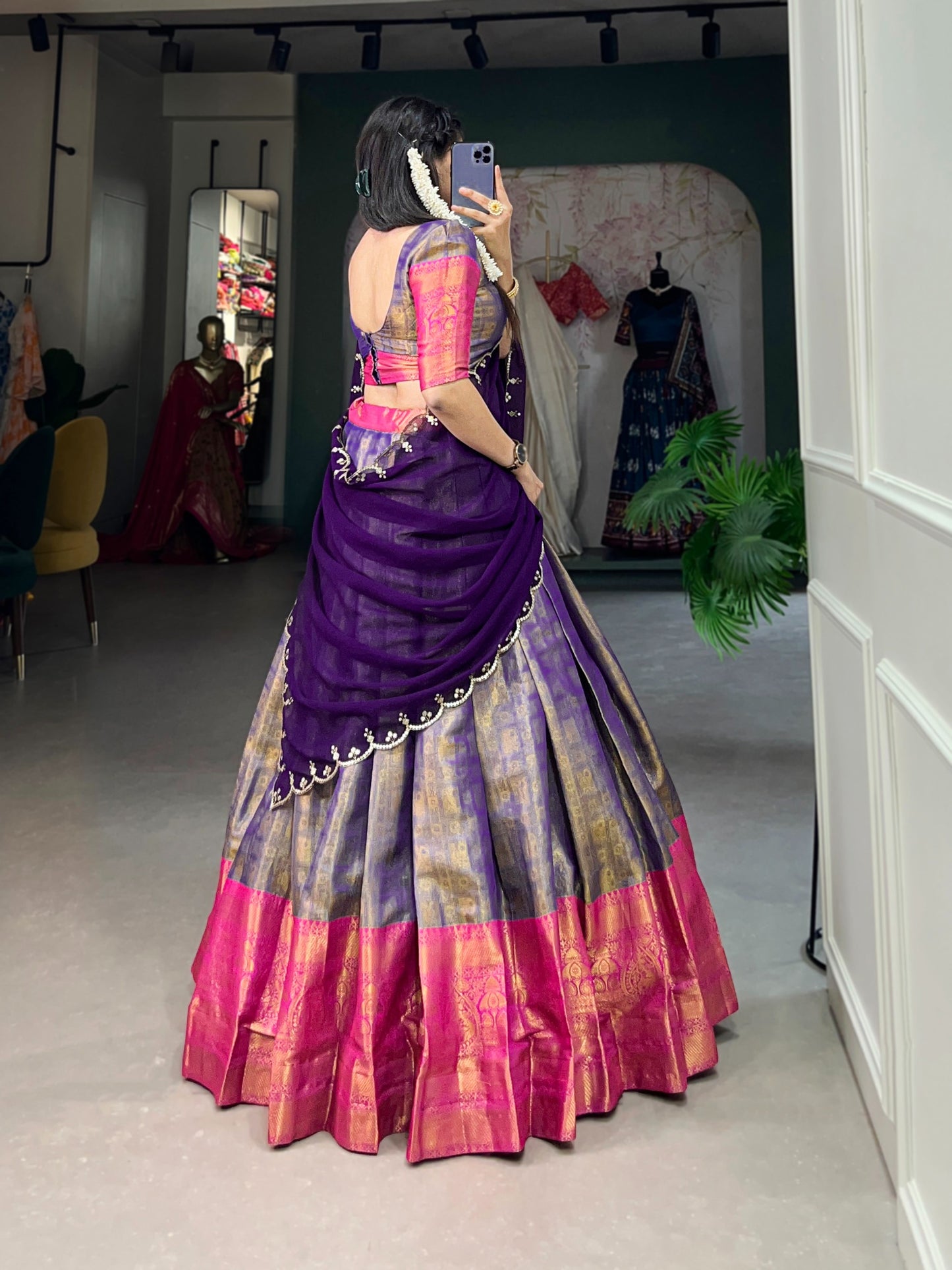 Experience the luxury of Kanjivaram silk in this regal lehenga choli ensemble, completed with a flowing embroidery dupatta.