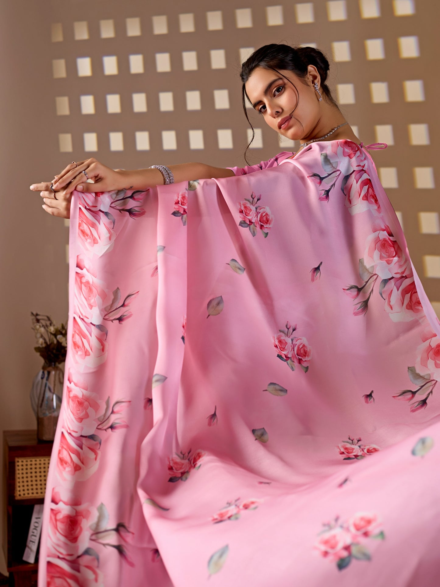 Elegant soft satin georgette saree featuring beautiful allover rose floral digital print in a soft baby pink tone, giving a graceful and charming look.