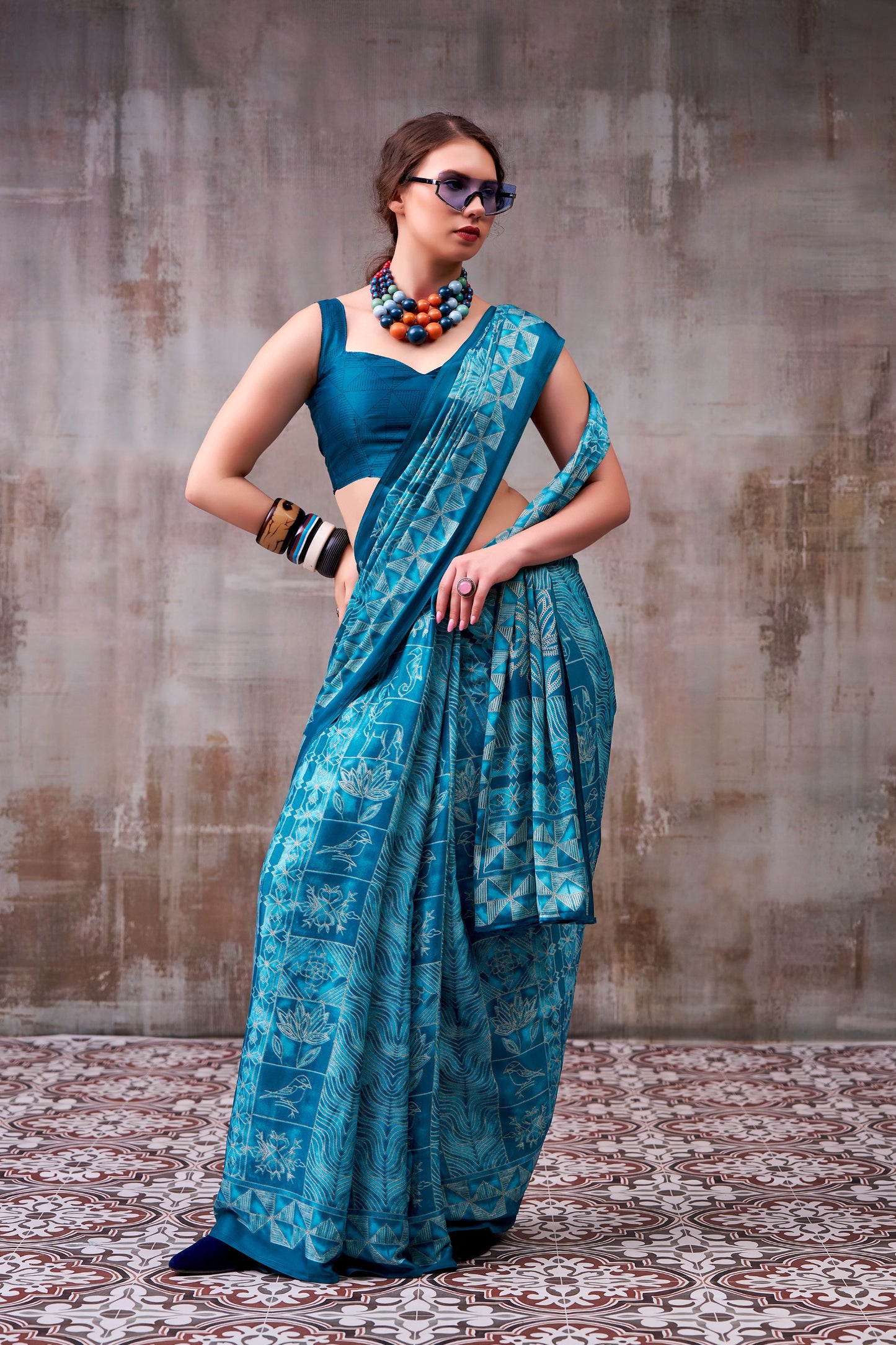 Elegance defined — draped in timeless grace with a floral & geometric printed saree that speaks style in every fold.🪷