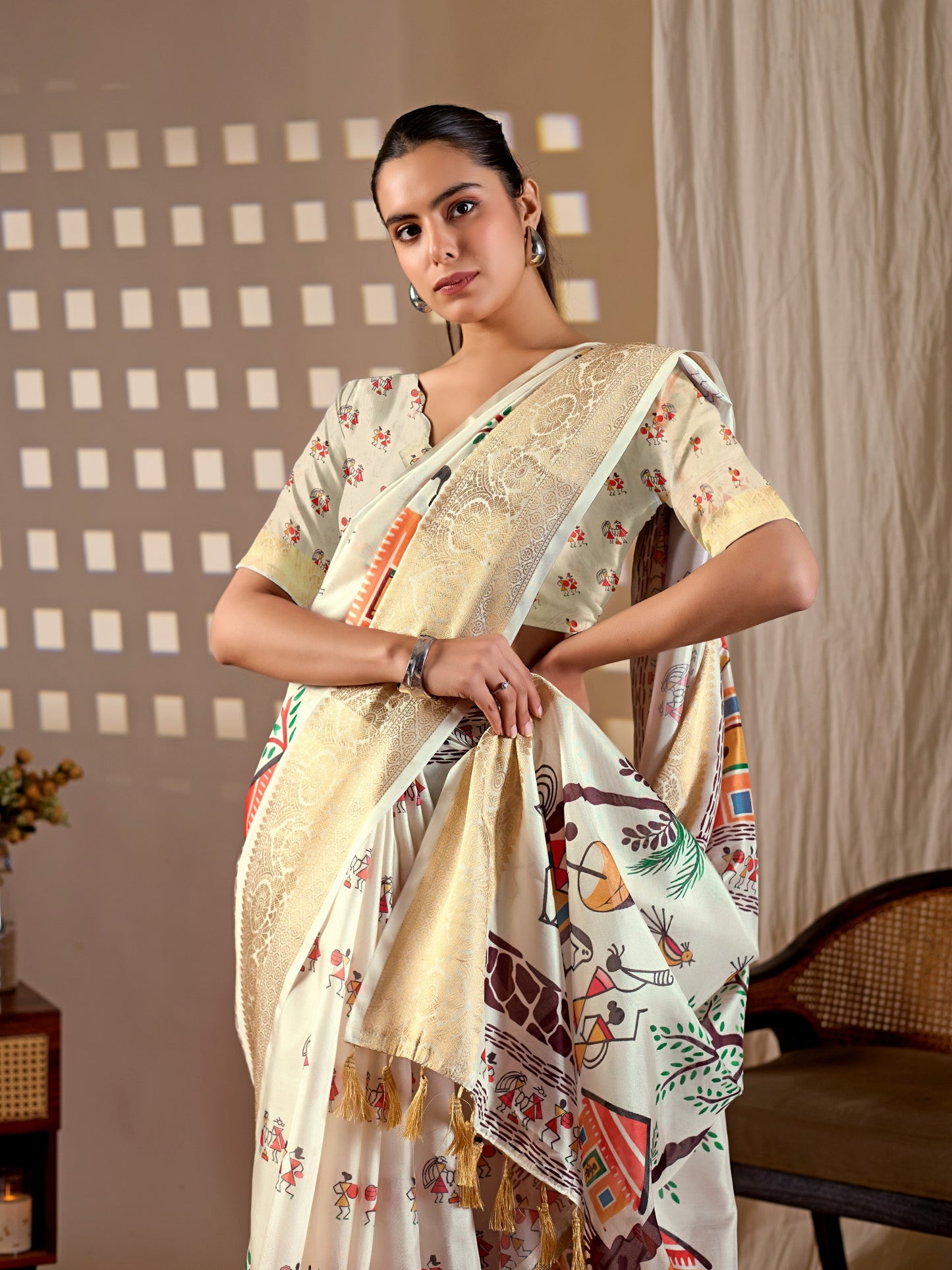 Soft Lichi Silk Saree with elegant traditional village art print in soothing cream shades and a rich woven border