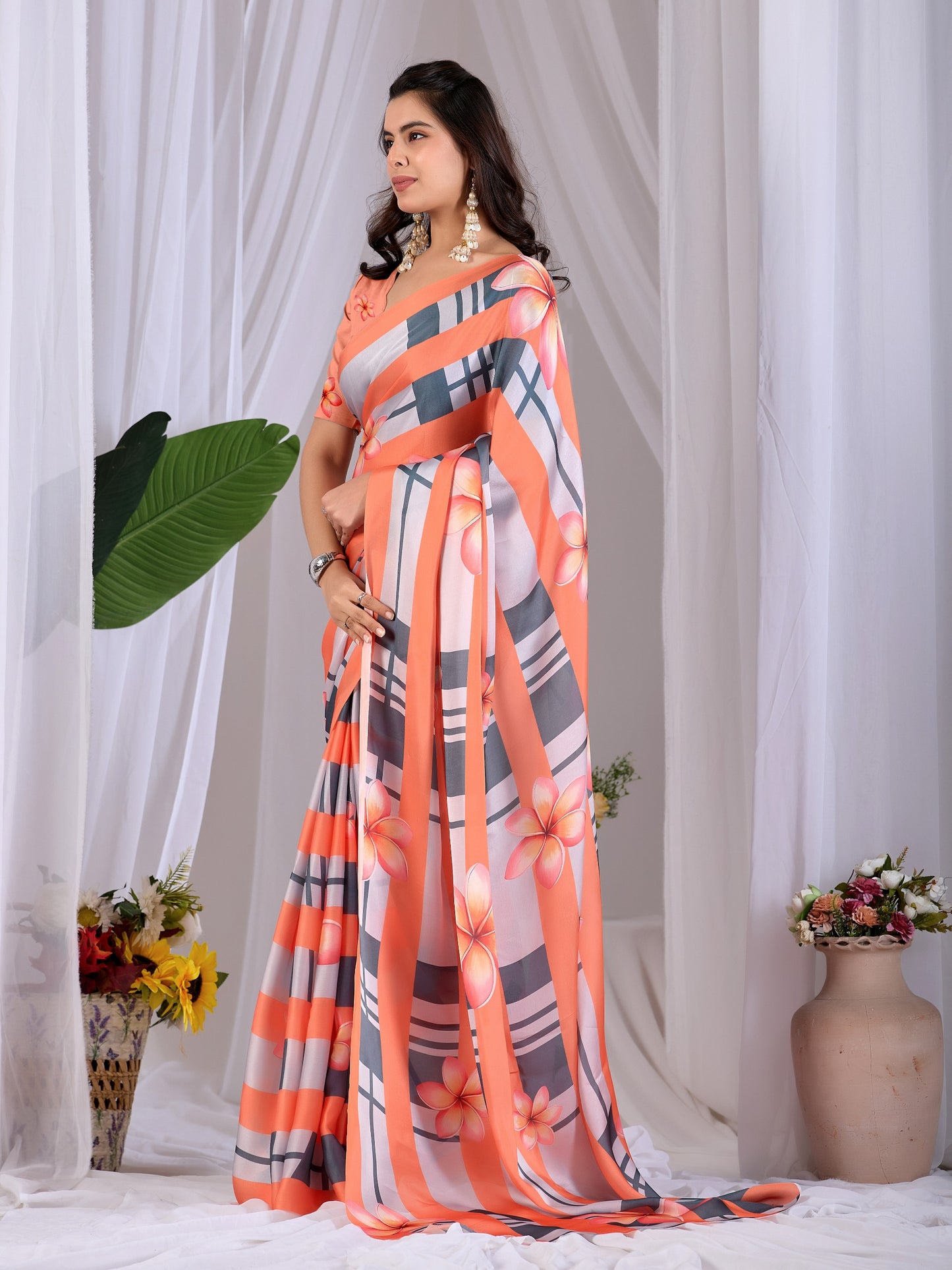 Elegant soft satin georgette saree featuring beautiful floral and striped digital print saree
