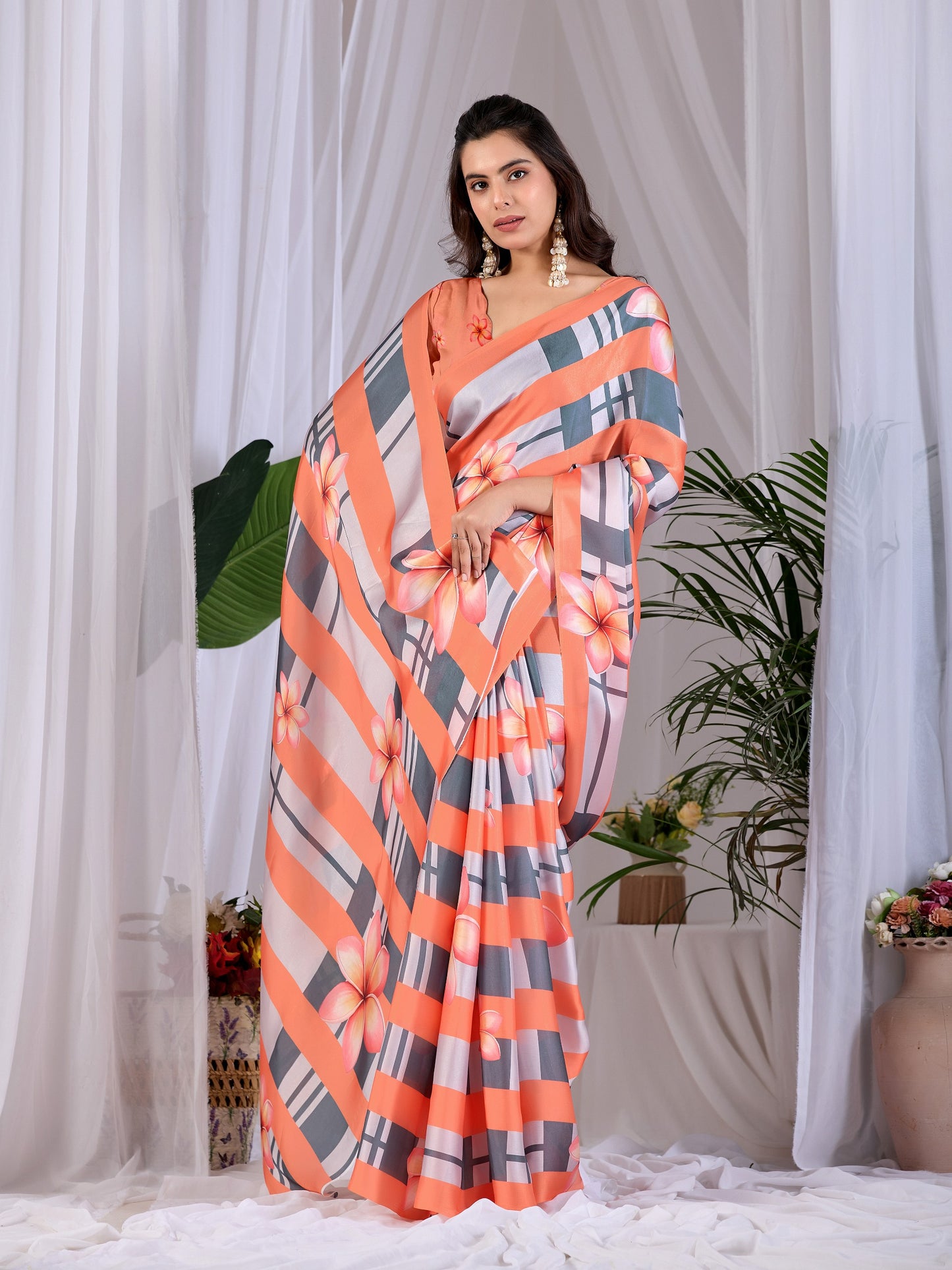 Elegant soft satin georgette saree featuring beautiful floral and striped digital print saree