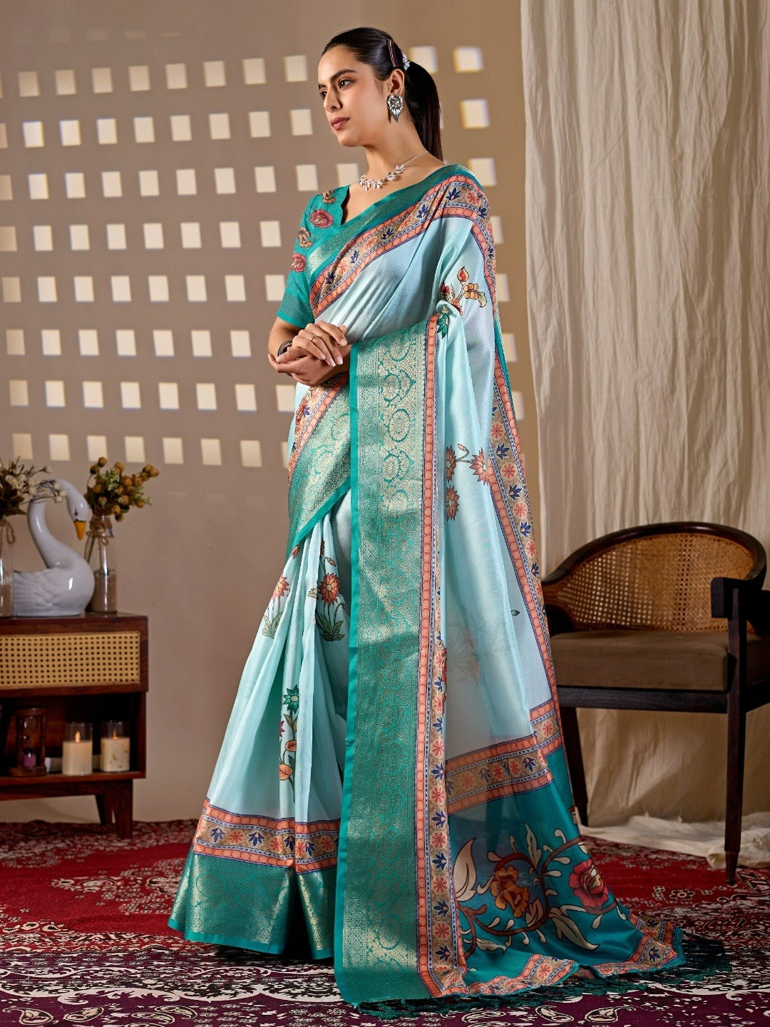 Soft Lichi Silk Saree with elegant floral print in soothing sky blue shades and a rich woven border