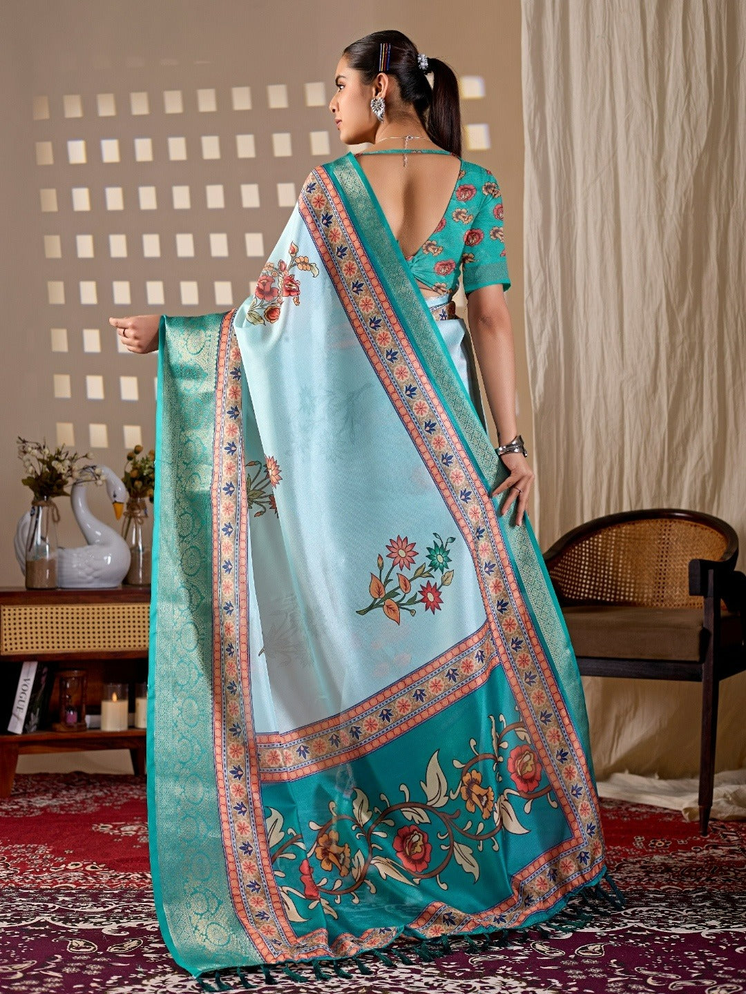 Soft Lichi Silk Saree with elegant floral print in soothing sky blue shades and a rich woven border