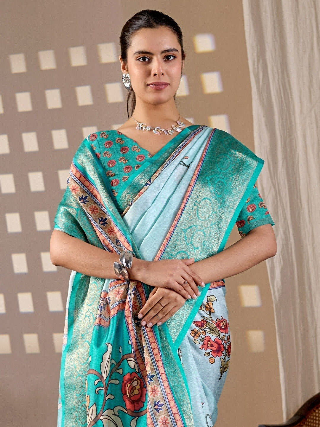 Soft Lichi Silk Saree with elegant floral print in soothing sky blue shades and a rich woven border