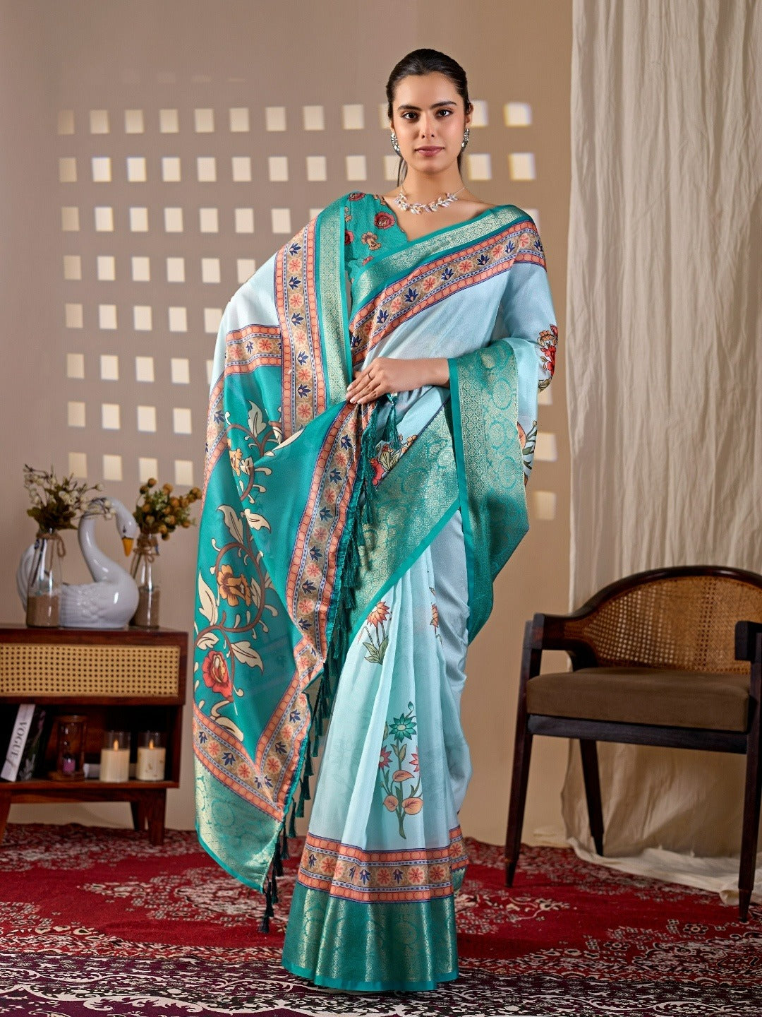Soft Lichi Silk Saree with elegant floral print in soothing sky blue shades and a rich woven border