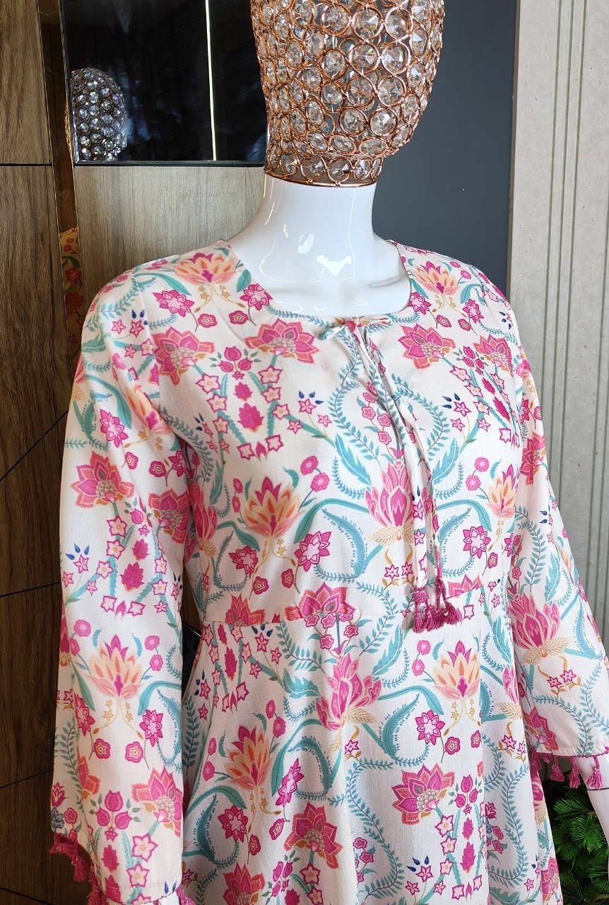 Boho-Chic Elegance: Pastel Pink Floral Printed Peplum Top with Playful Fringed Tassels for a Perfect Indo-Western Vibe 💕