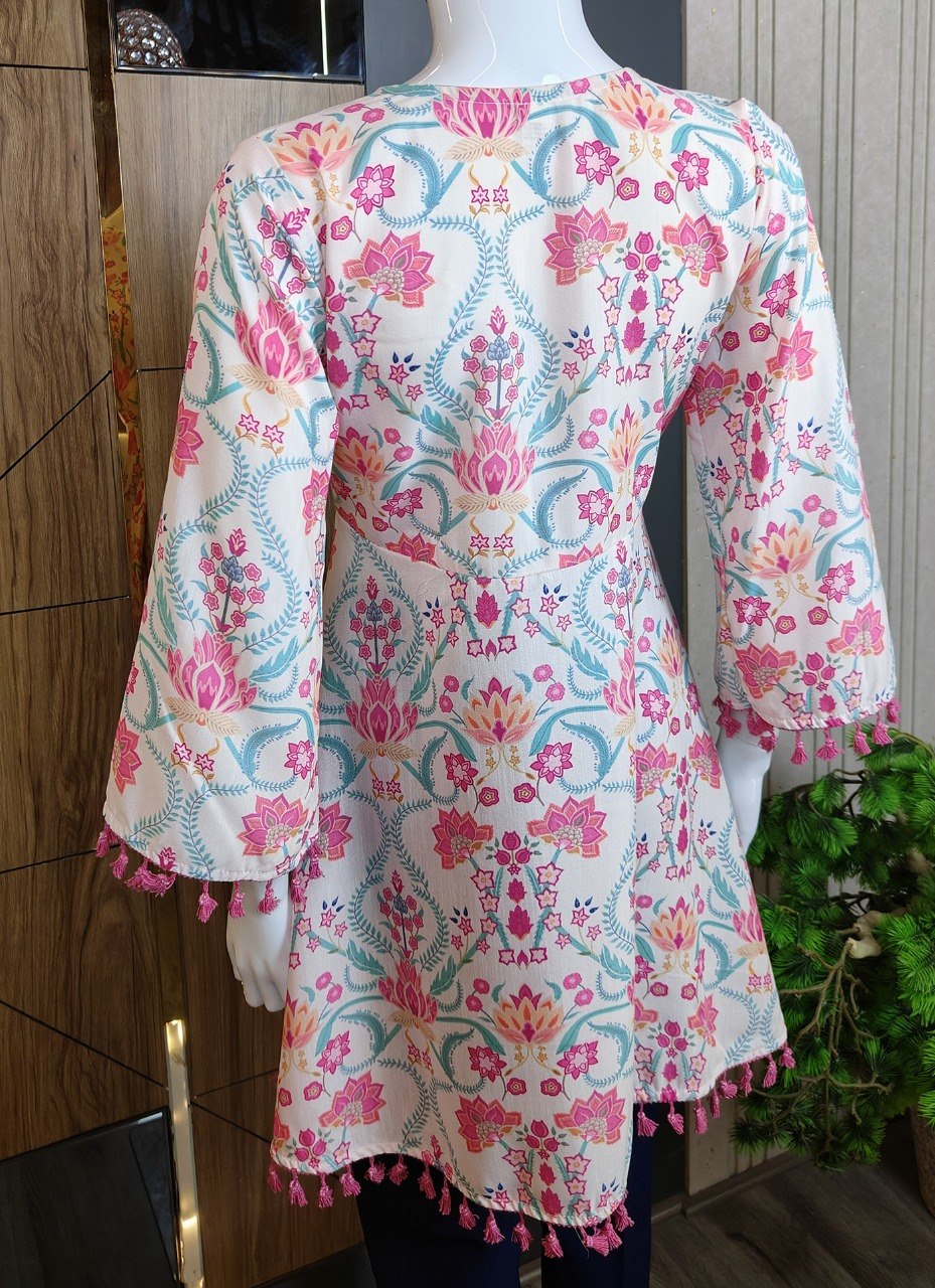 Boho-Chic Elegance: Pastel Pink Floral Printed Peplum Top with Playful Fringed Tassels for a Perfect Indo-Western Vibe 💕