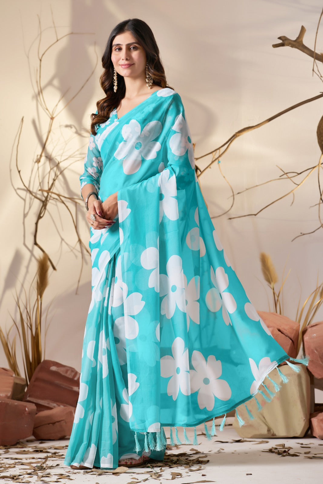 Vibrant Turquoise Blue Georgette Saree with Oversized White Floral Prints and Tassel Borders