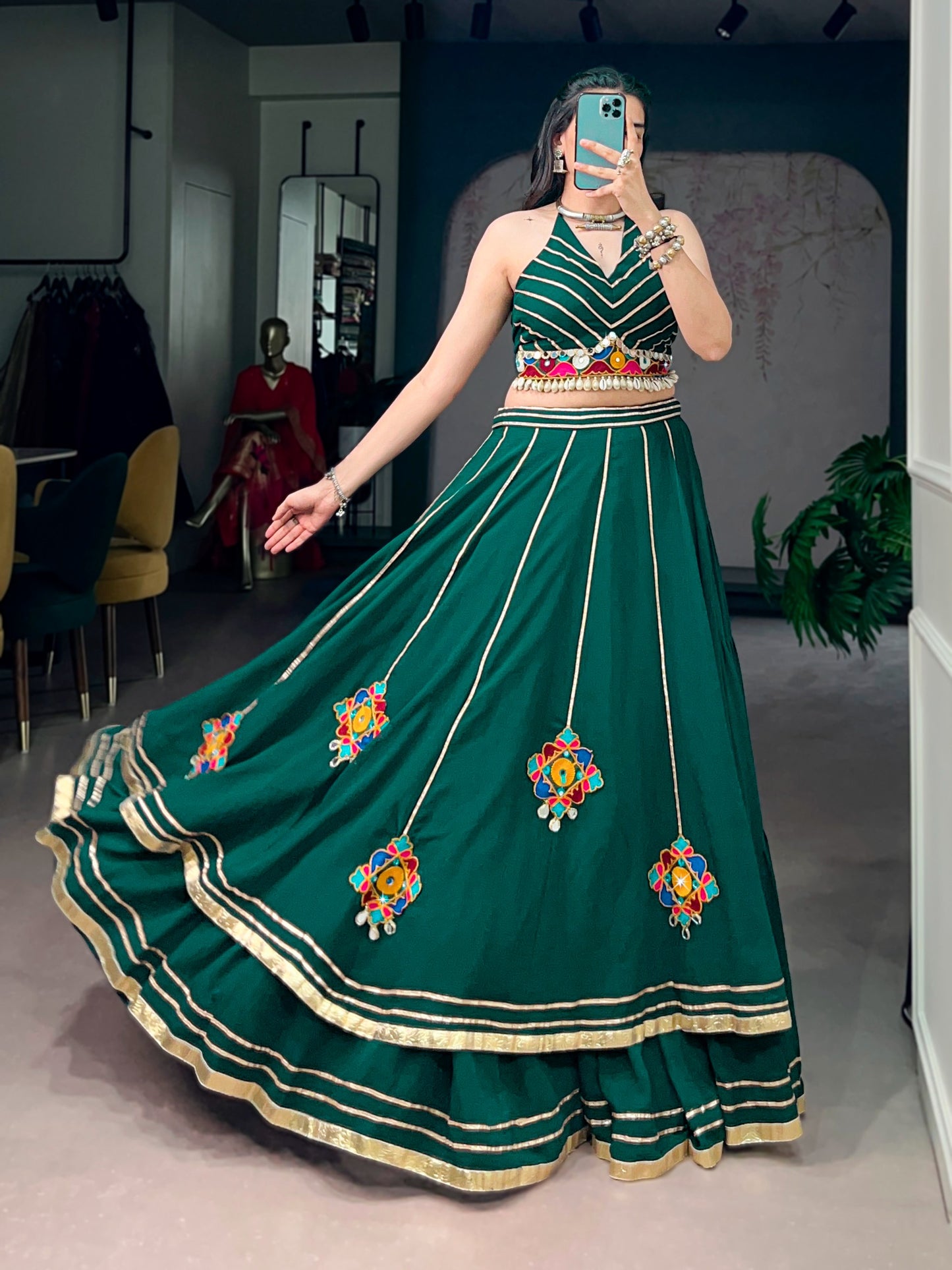 Lightweight fabric with vibrant Gamthi work, mirror detailing, Gotta Patti lace, and shell embellishments