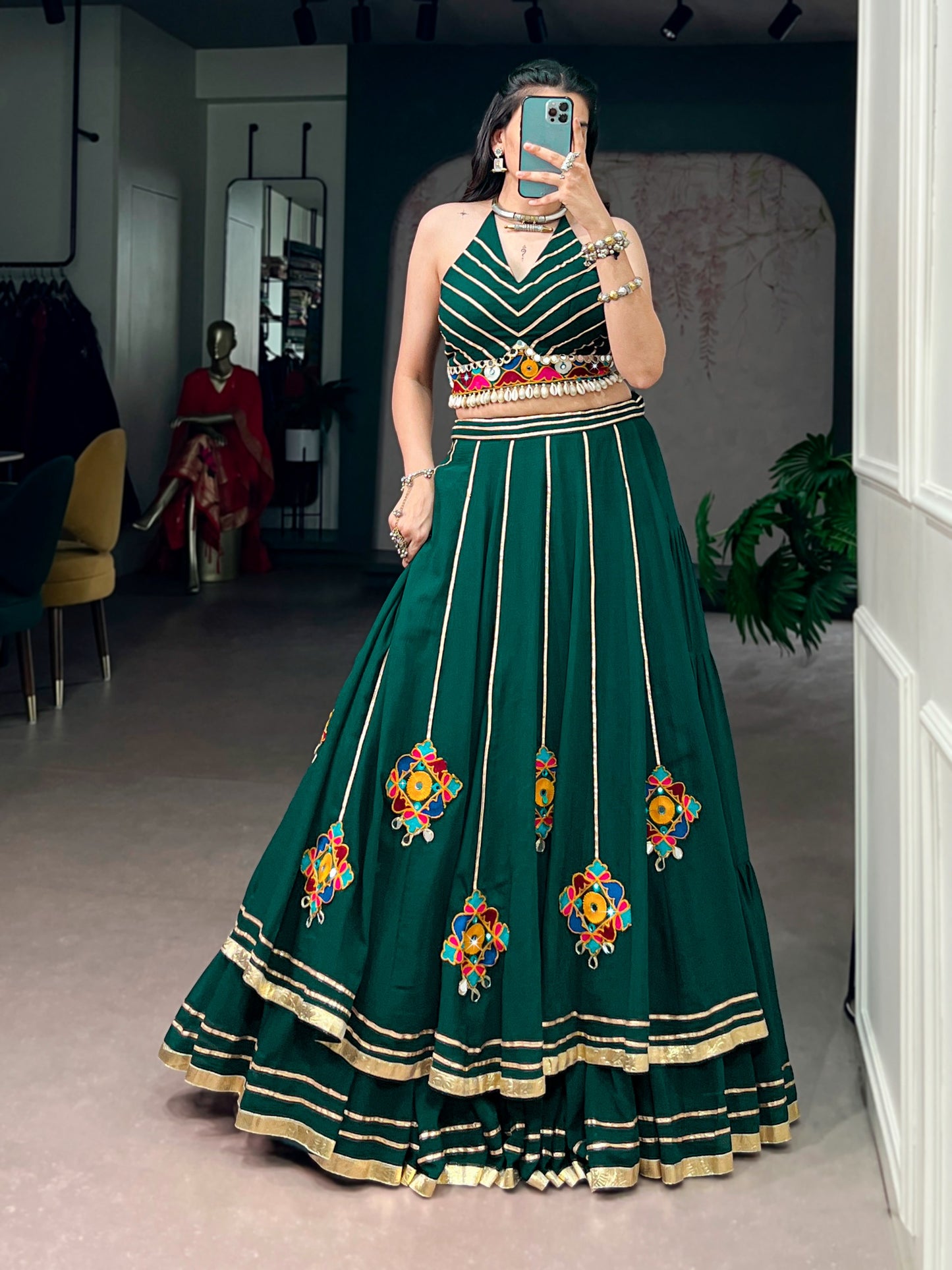 Lightweight fabric with vibrant Gamthi work, mirror detailing, Gotta Patti lace, and shell embellishments