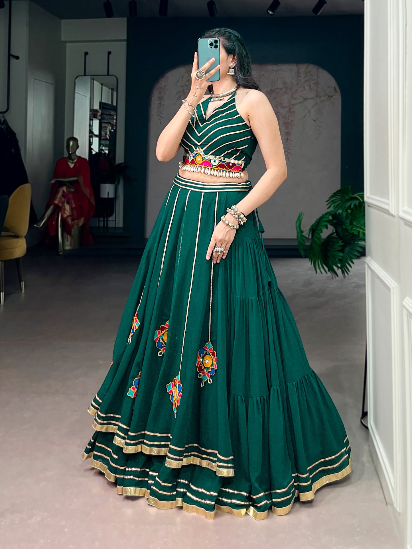 Lightweight fabric with vibrant Gamthi work, mirror detailing, Gotta Patti lace, and shell embellishments