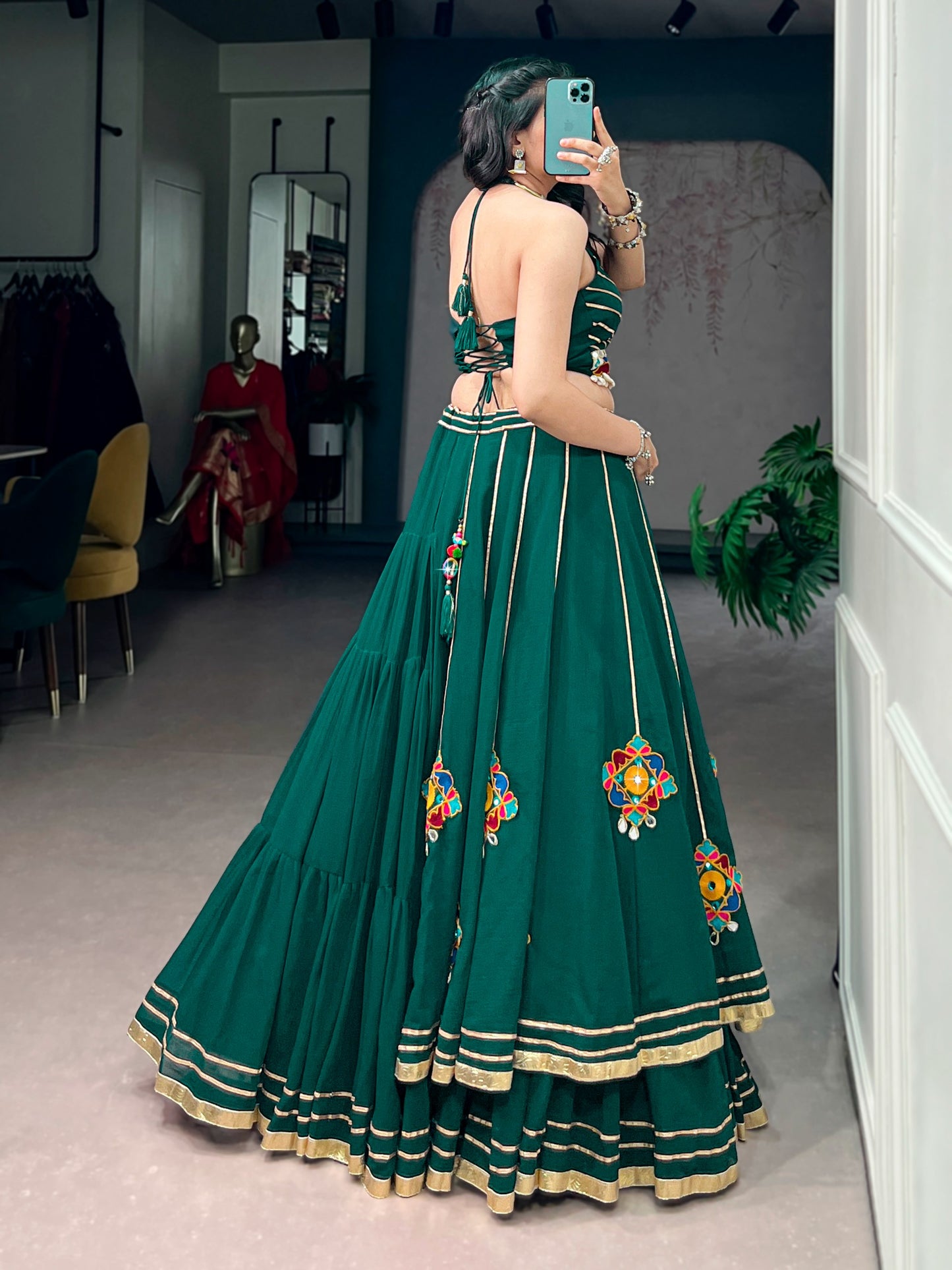 Lightweight fabric with vibrant Gamthi work, mirror detailing, Gotta Patti lace, and shell embellishments