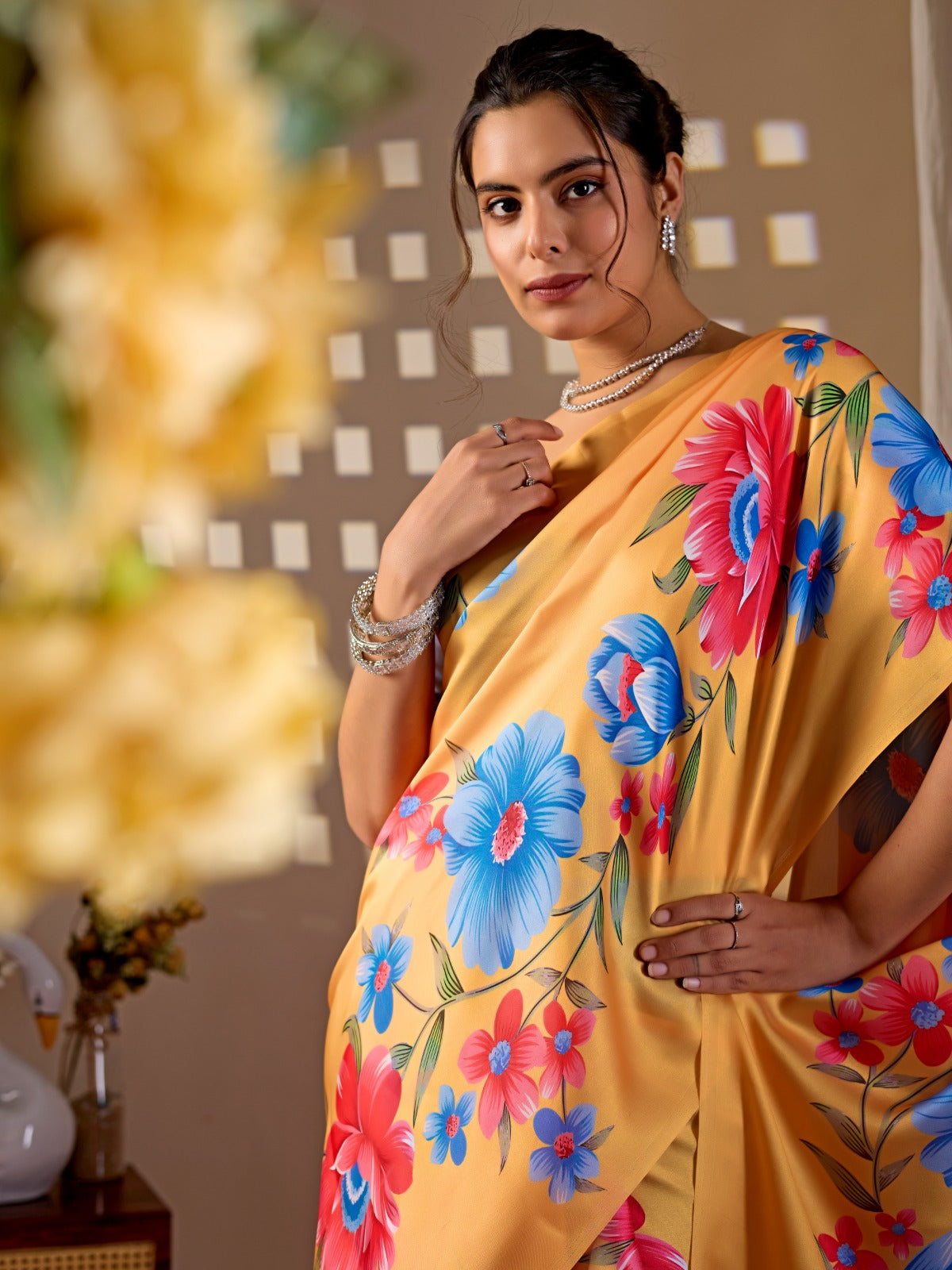 Elegant Golden Ochre Silk-Satin Saree Featuring Bold Contemporary Botanical Flower Motifs
