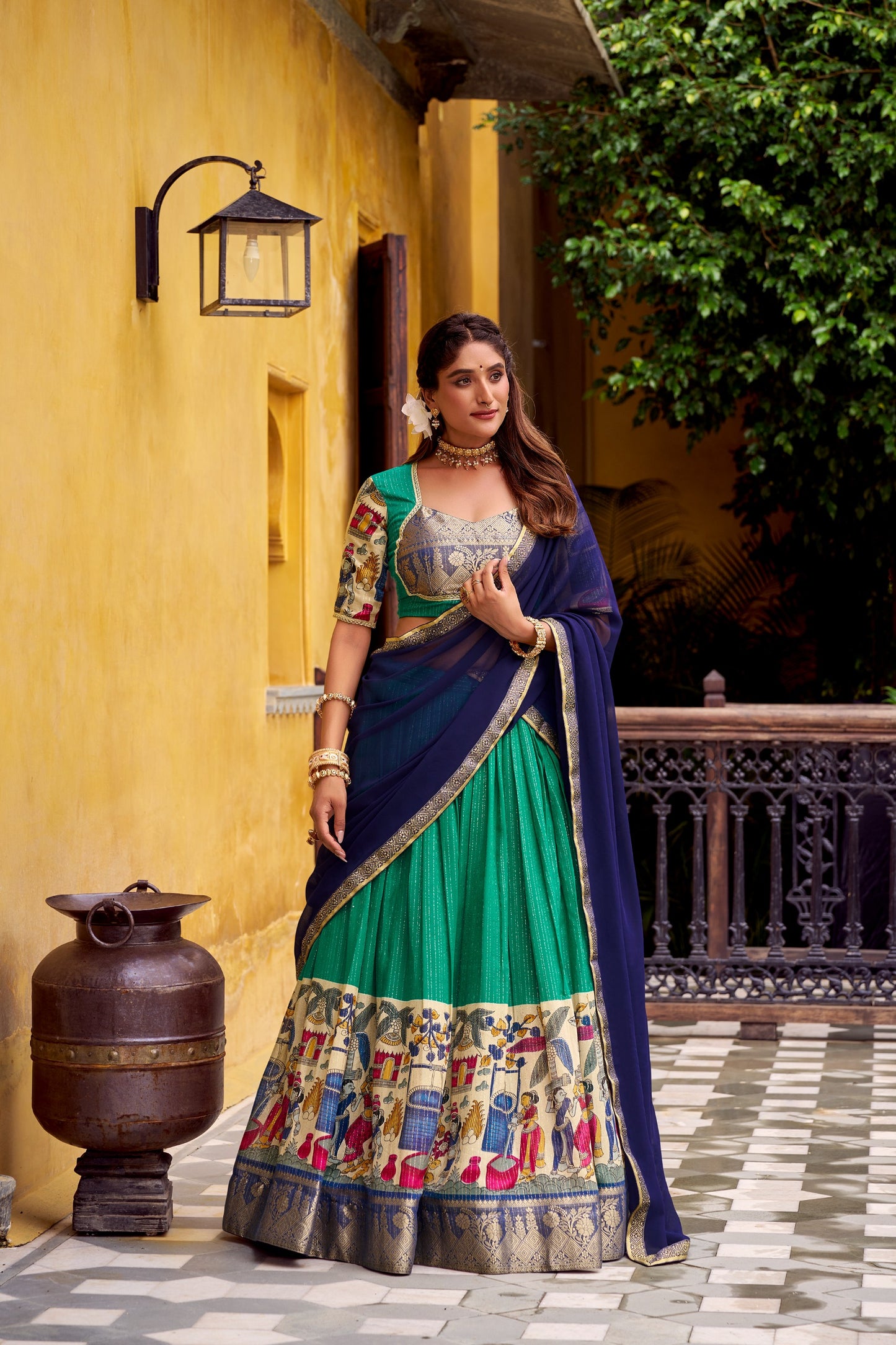 Step into timeless elegance with this Poly Chanderi lehenga, designed with delicate Zari stripes and enhanced with Kalamkari prints 🪷