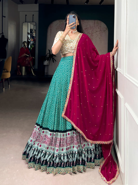 A beautiful blend of Bandhej and Ajrakh prints on soft rayon fabric, enhanced with delicate sequins, thread embroidery, and elegant lace detailing 🪞