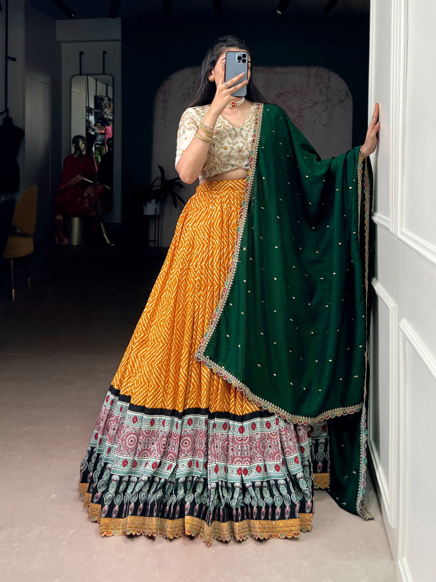 A beautiful blend of Bandhej and Ajrakh prints on soft rayon fabric, enhanced with delicate sequins, thread embroidery, and elegant lace detailing 🪞