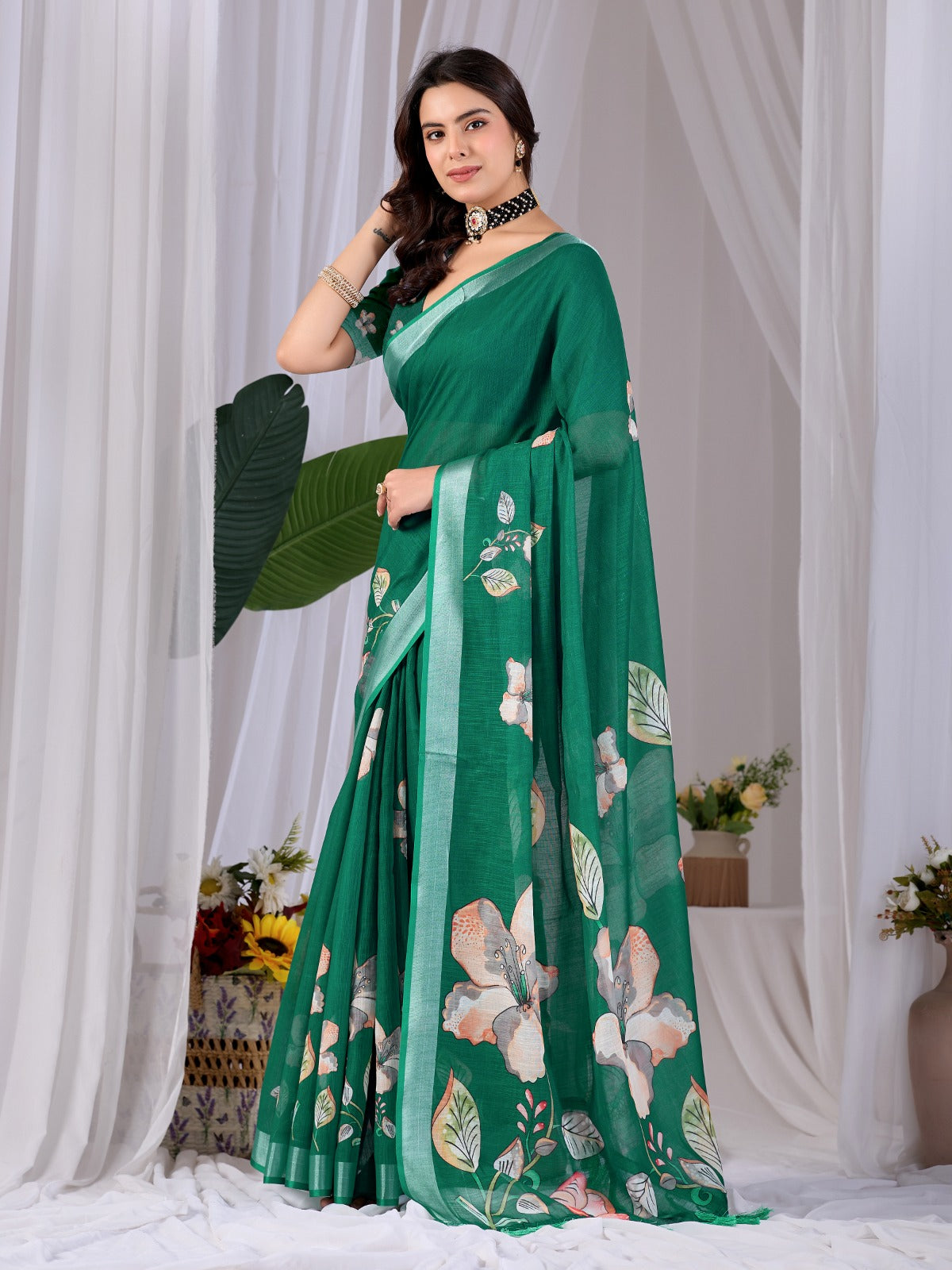 Elegant Emerald Green Festive Saree with Soft Peach and White Floral Accents and Pallu Tassels