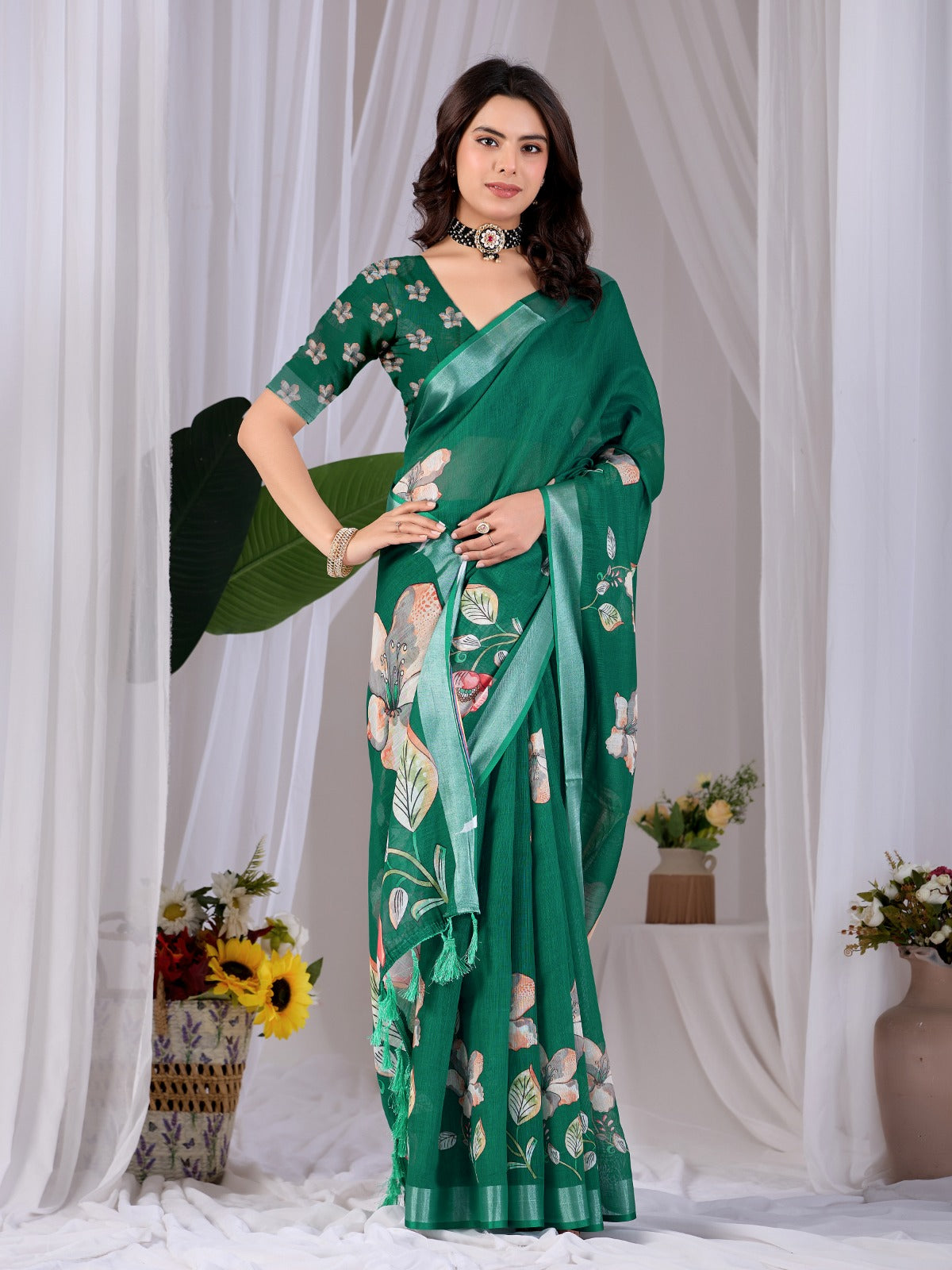 Elegant Emerald Green Festive Saree with Soft Peach and White Floral Accents and Pallu Tassels