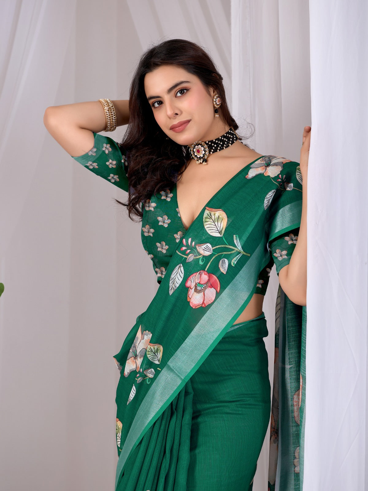 Elegant Emerald Green Festive Saree with Soft Peach and White Floral Accents and Pallu Tassels