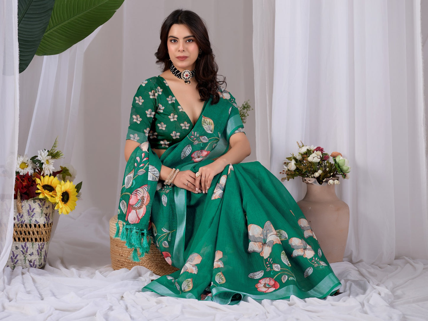 Elegant Emerald Green Festive Saree with Soft Peach and White Floral Accents and Pallu Tassels