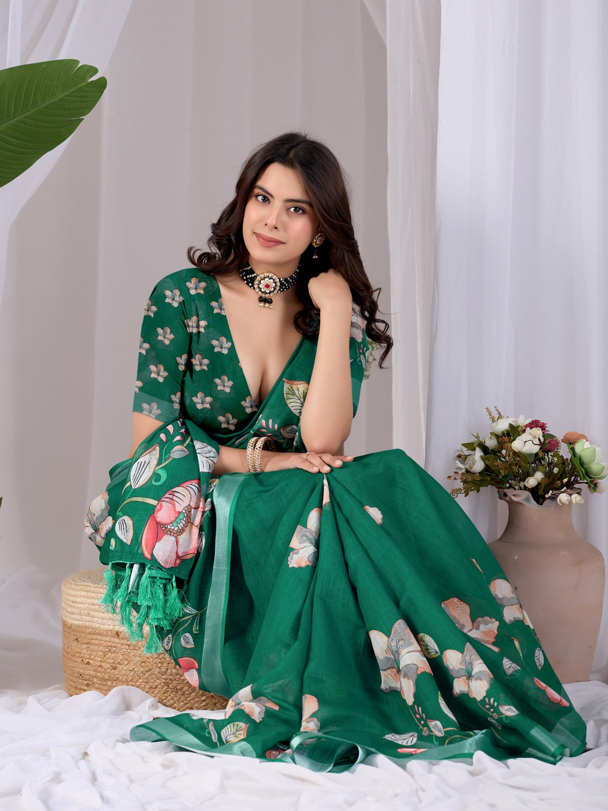 Elegant Emerald Green Festive Saree with Soft Peach and White Floral Accents and Pallu Tassels