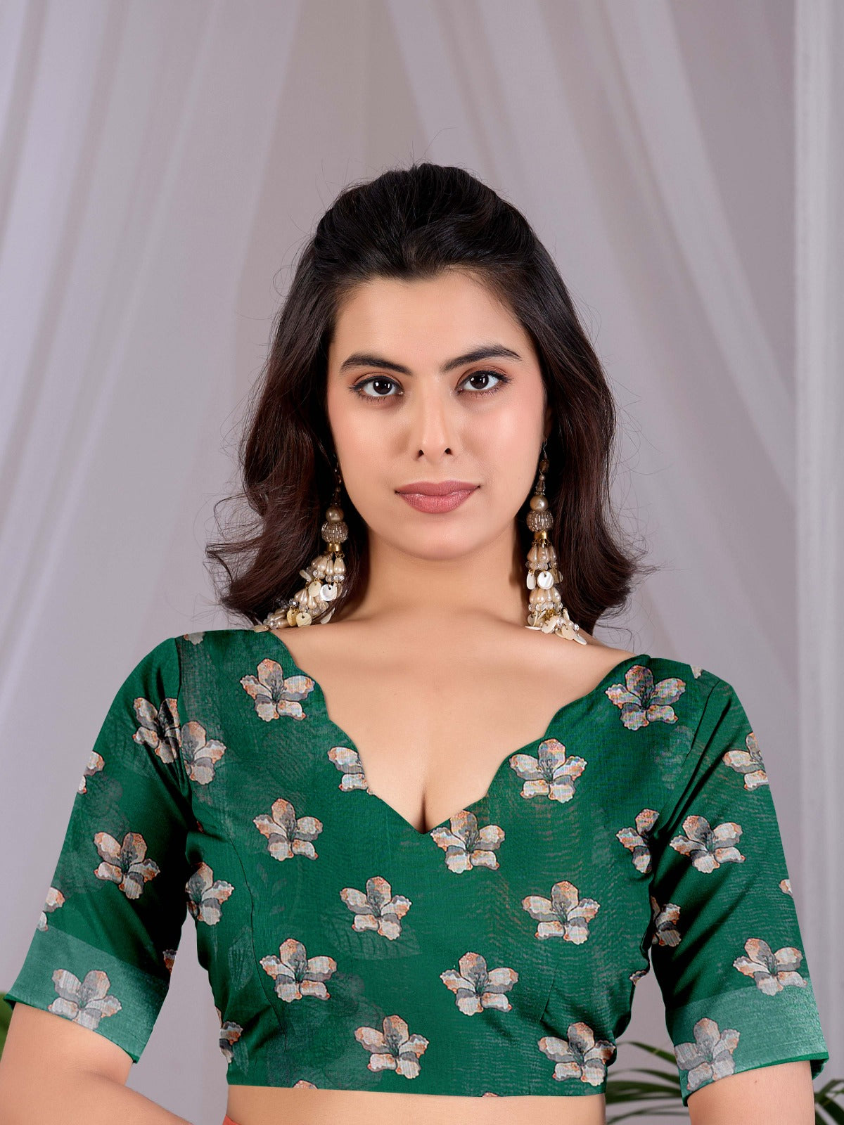 Elegant Emerald Green Festive Saree with Soft Peach and White Floral Accents and Pallu Tassels