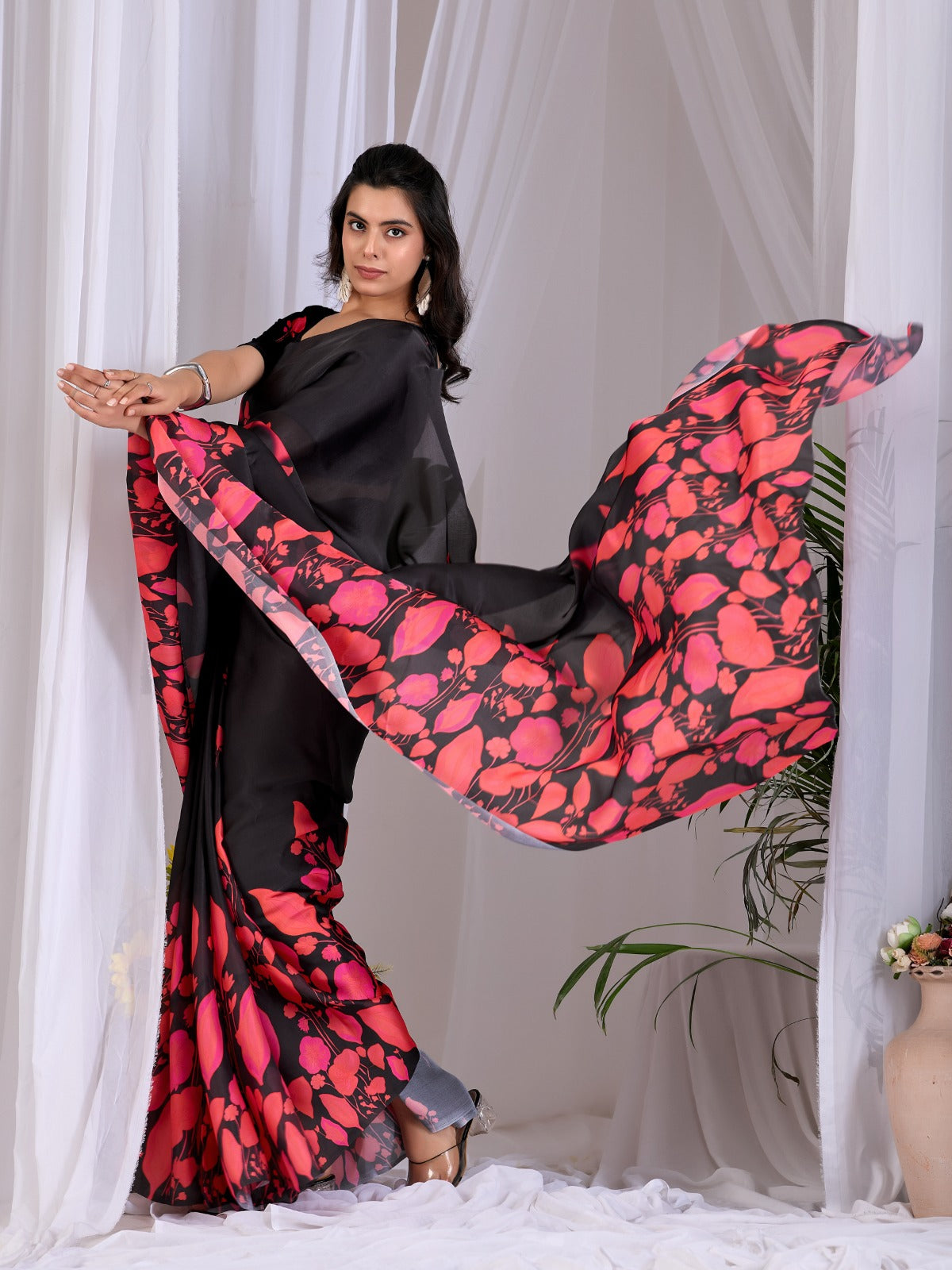 Contemporary Jet Black Festive Saree with Contrast Pink and Coral Floral Pallu Details