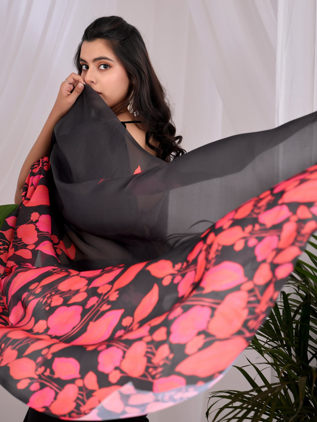 Contemporary Jet Black Festive Saree with Contrast Pink and Coral Floral Pallu Details