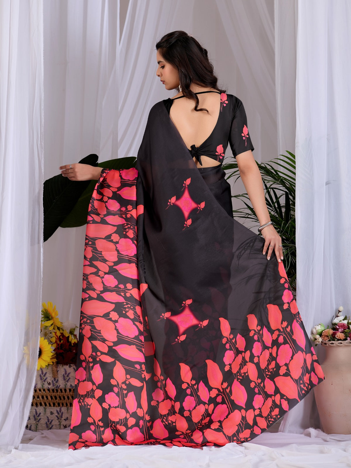Contemporary Jet Black Festive Saree with Contrast Pink and Coral Floral Pallu Details